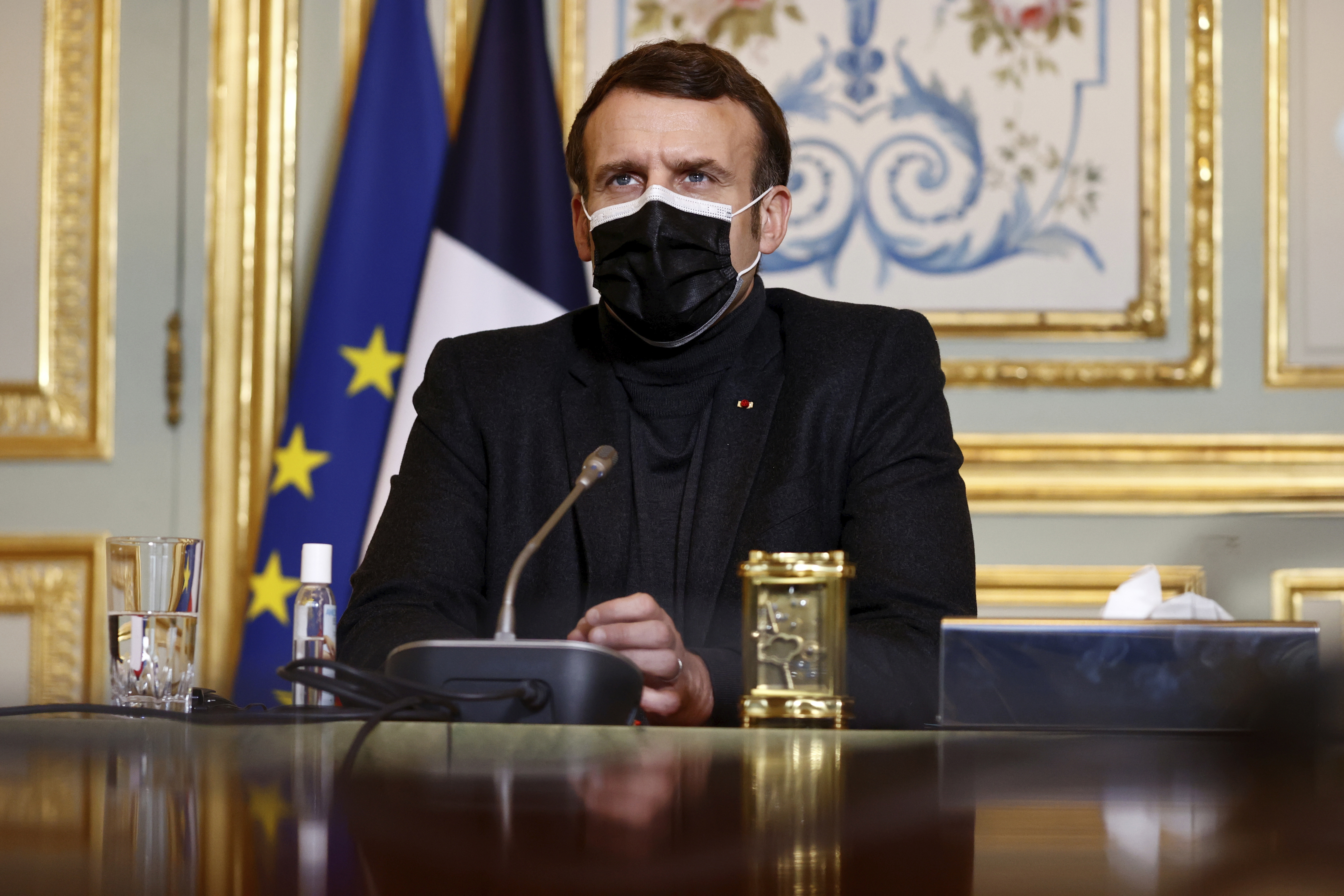 French President Macron attends a video-conference meeting with WHO Director-General Tedros Adhanom Ghebreyesus