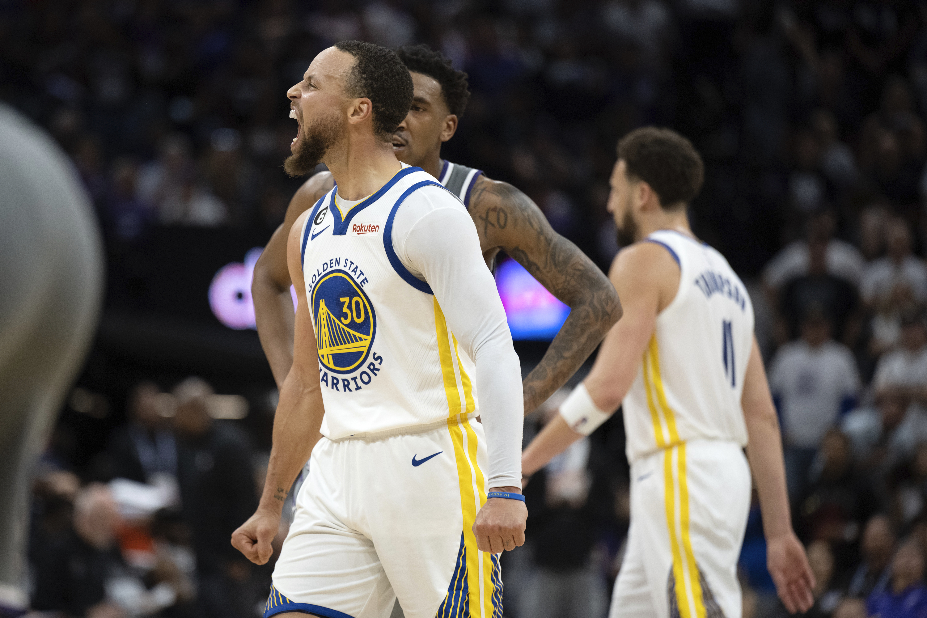 Golden State Warriors guard Stephen Curry (30) lets out a scream after making a basket against the Sacramento Kings during the second half of Game 5 of an NBA basketball first-round playoff series Wednesday, April 26, 2023, in Sacramento, Calif. (AP Photo/José Luis Villegas)