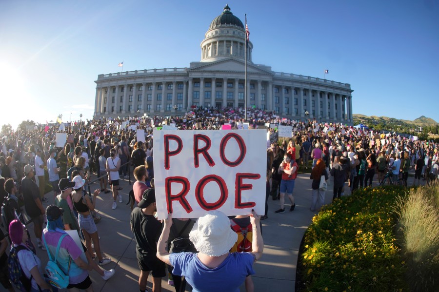 FILE - People attend an abortion-rights rally at the Utah State Capitol in Salt Lake City after the U.S. Supreme Court overturned Roe v. Wade, June 24, 2022. A Utah court on Friday, April 28, 2023, will consider a request from Planned Parenthood to delay implementing a statewide ban on abortion clinics set to begin taking effect next week. The organization in a motion filed earlier this month argued a state law passed earlier this year will severely curtail access to abortion in Utah. (AP Photo/Rick Bowmer, File)