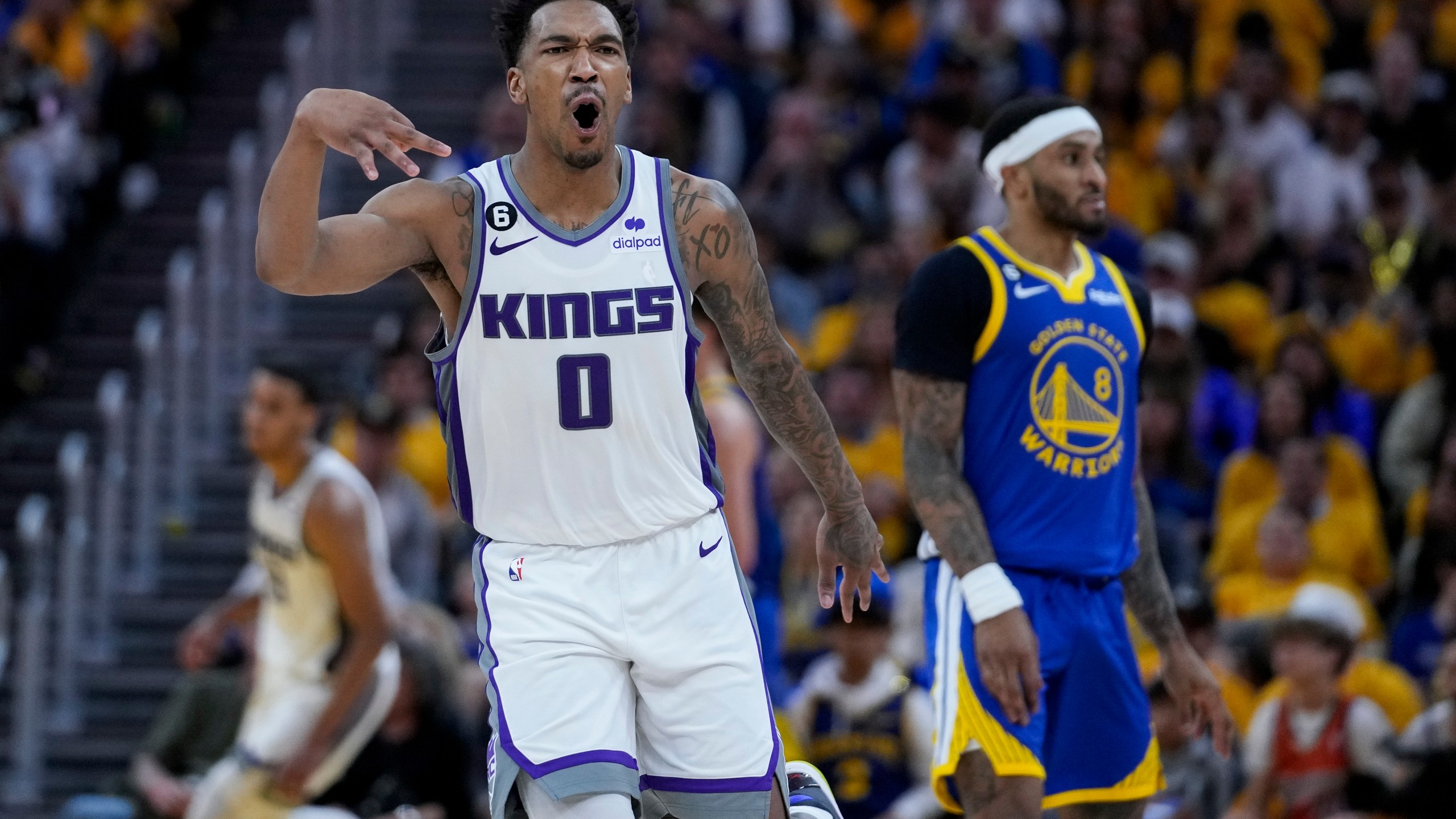 Sacramento Kings' Malik Monk (0) reacts after making a 3-point basket against the Golden State Warriors during the second half of Game 6 of a first-round NBA basketball playoff series in San Francisco, Friday, April 28, 2023. (AP Photo/Godofredo A. Vásquez)