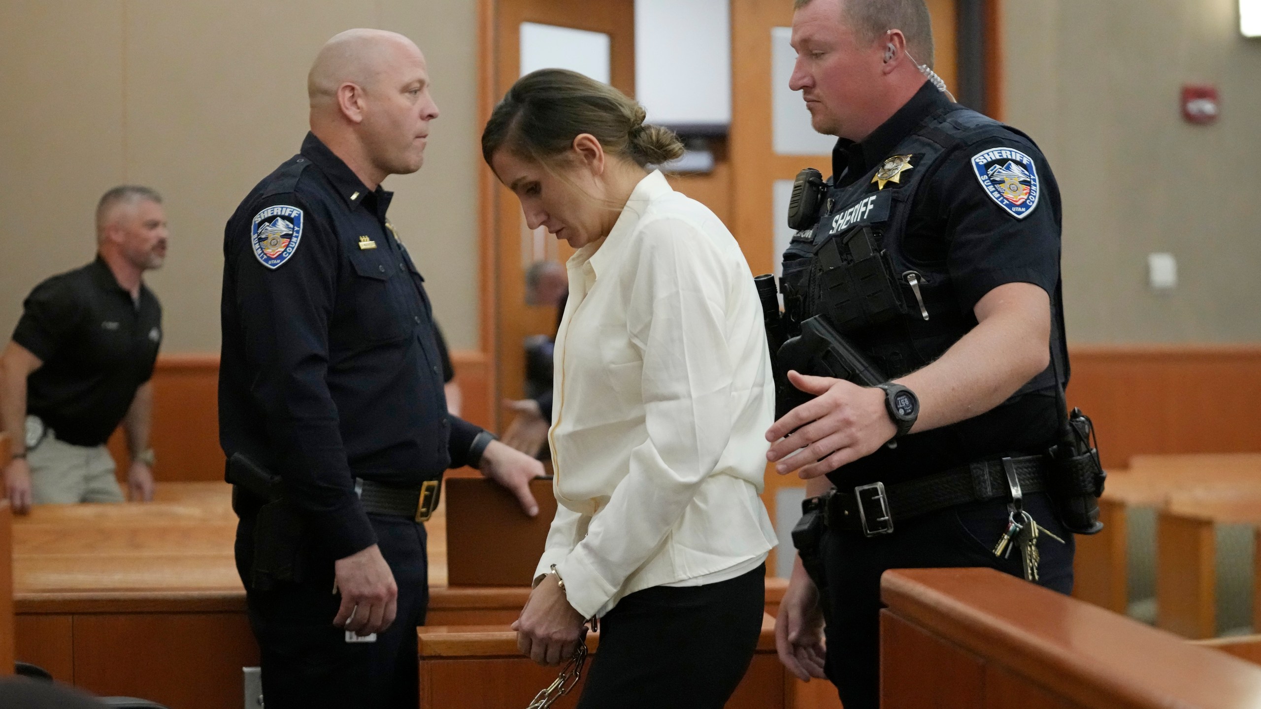 Kouri Richins, a Utah mother of three who authorities say fatally poisoned her husband then wrote a children's book about grieving, walks out of the court during a recess at a bail hearing Monday, June 12, 2023, in Park City, Utah. A judge ruled to keep her in custody for the duration of her trial. (AP Photo/Rick Bowmer, Pool)