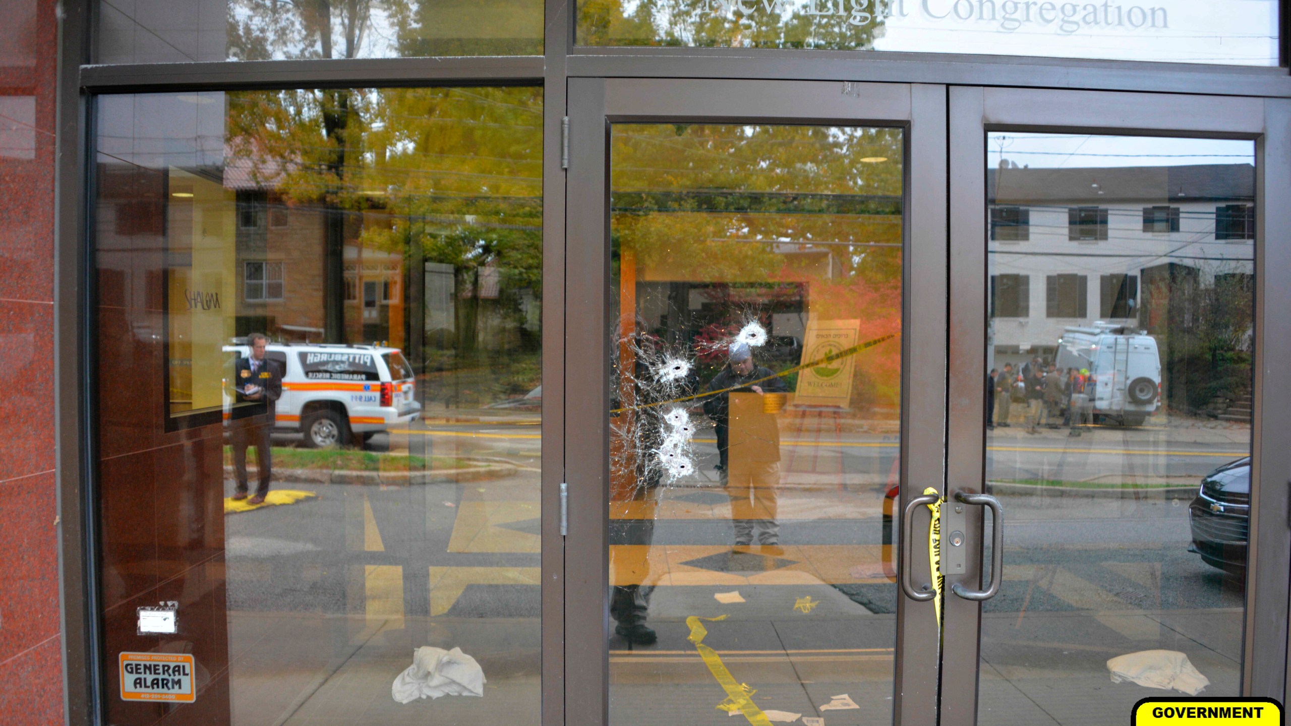 This photo of bullet damaged doors in the Tree of Life synagogue building in Pittsburgh was entered June 1, 2023, as a court exhibit by prosecutors in the federal trial of Robert Bowers. He faces multiple charges in the killing of 11 worshippers from three congregations and the wounding of seven worshippers and police officers in the building on Oct. 27, 2018. The charges include the obstruction of the free exercise of religion, resulting in death. (U.S. District Court for the Western District of Pennsylvania via AP)