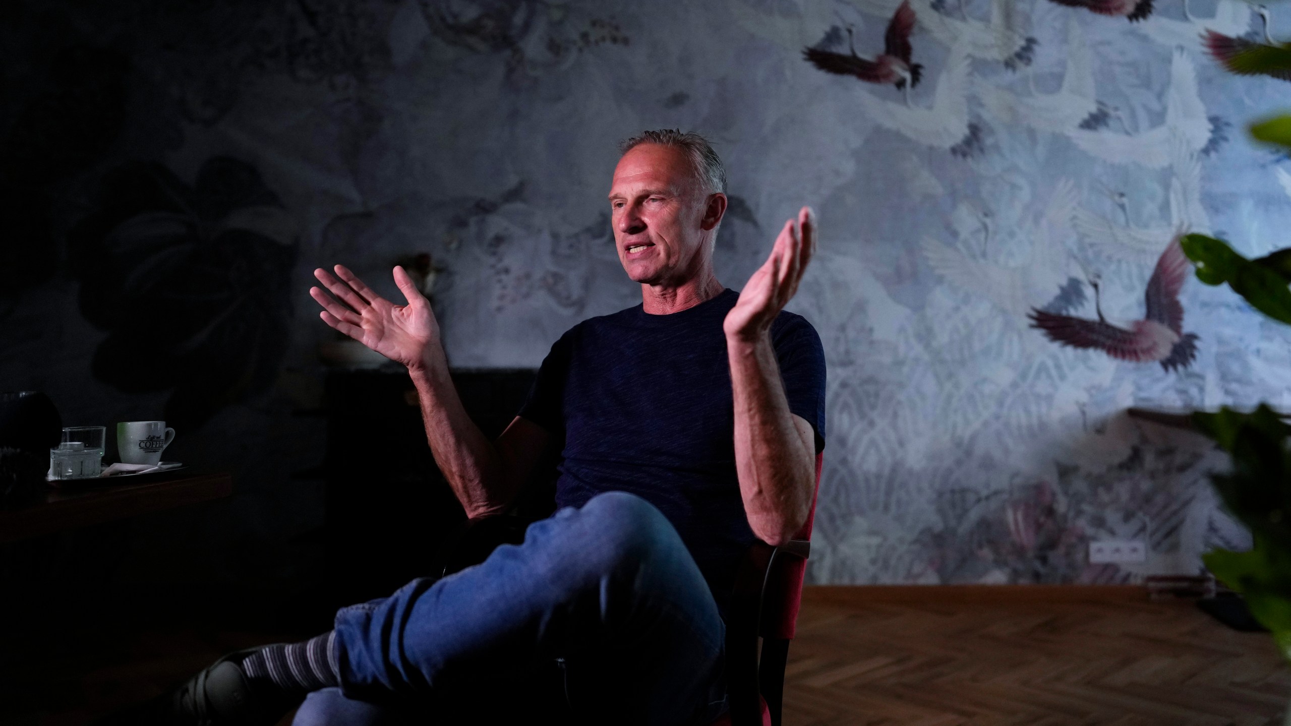 Former NHL goalkeeper Dominik Hasek gestures during an interview with The Associated Press in Prague, Czech Republic, Wednesday, June 28, 2023. The NHL great has been a prominent and vocal critic of the International Olympic Committee's recommendation that Russians and Belarusians could compete in international competitions after being approved as neutrals. (AP Photo/Petr David Josek)