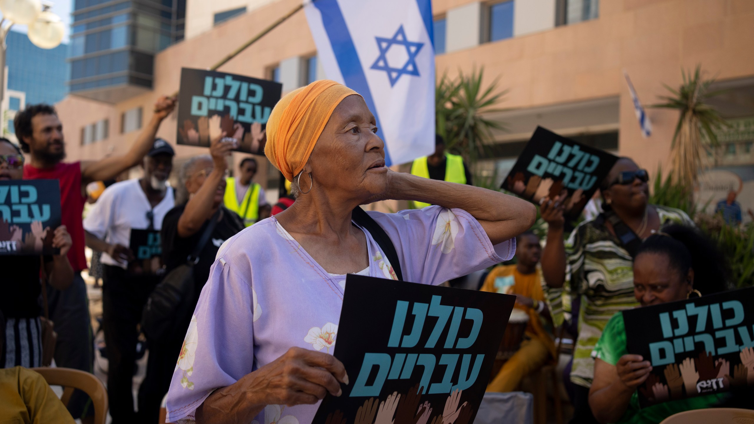 Members of the Hebrew Israelite community rally outside of the District Court in Beersheba, Israel, ahead of a hearing on the deportation orders for dozens from their community, Wednesday, July 19, 2023. The community's decades-long plight to secure their status shines a light on Israel's strict immigration policy, which grants people whom it considers Jewish automatic citizenship but limits entry to others who don't fall within that definition. (AP Photo/Maya Alleruzzo)