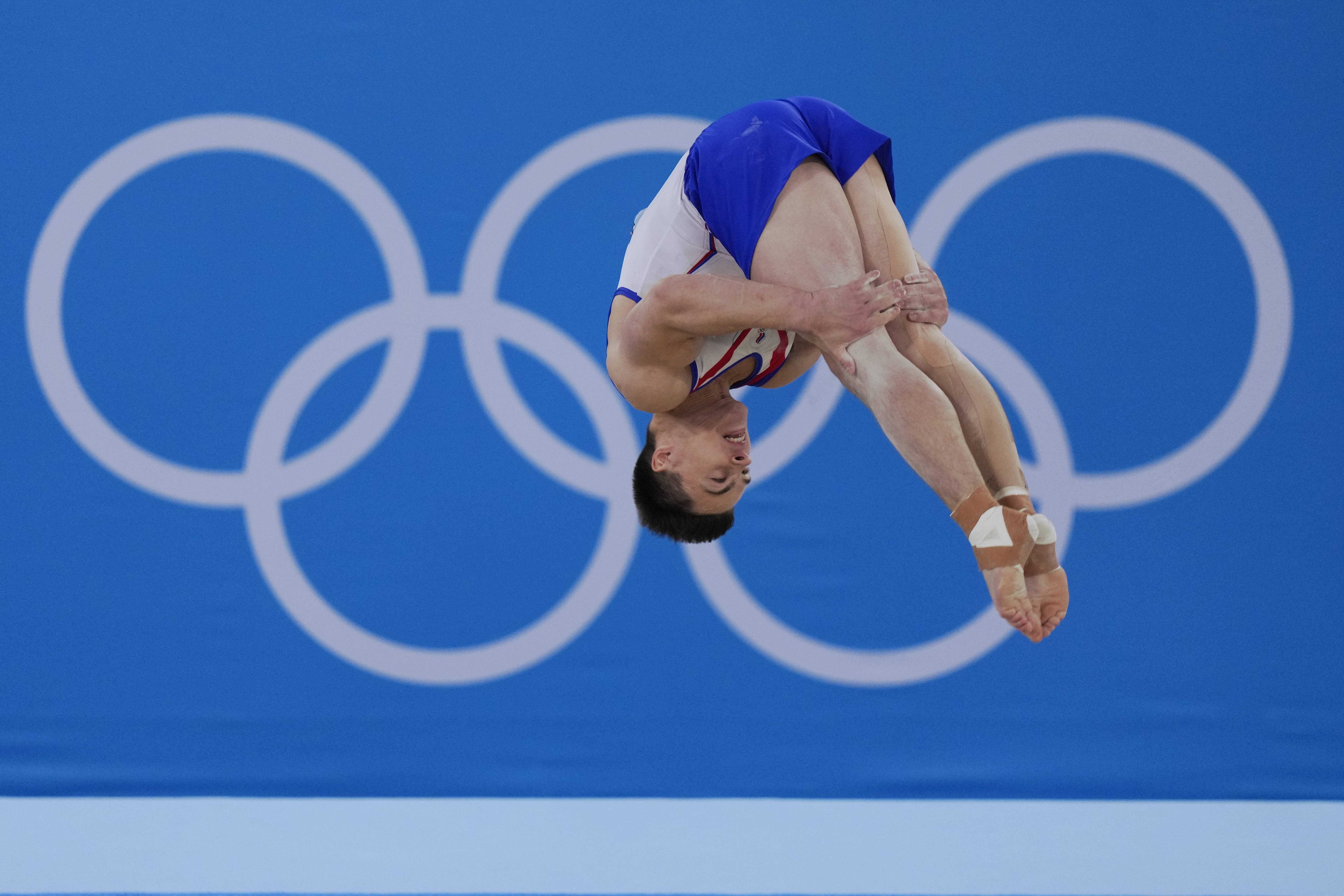 FILE - Nikita Nagornyy, of the Russian Olympic Committee, performs on the floor during the artistic gymnastic men's all-around final at the 2020 Summer Olympics, Wednesday, July 28, 2021, in Tokyo. A year out from the Paris Olympics, and nearly a year and a half since Russia's full-scale invasion of Ukraine, officials governing the many sports on the Olympic program are still split on how to treat Russian athletes. (AP Photo/Gregory Bull, File)