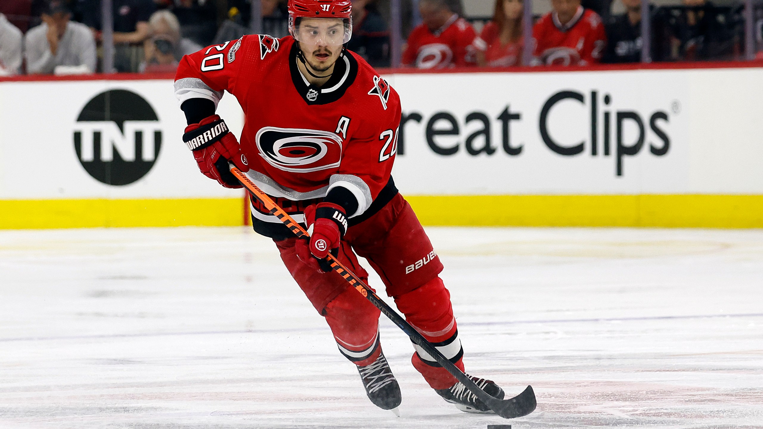 FILE - Carolina Hurricanes' Sebastian Aho (20) skates with the puck against the Florida Panthers during the second period of Game 2 of the NHL hockey Stanley Cup Eastern Conference finals in Raleigh, N.C., Saturday, May 20, 2023. Sebastian Aho is staying with the Carolina Hurricanes through his prime after signing an eight-year contract extension worth $78 million. The team on Wednesday, July 26, announced the deal, which goes into effect for the 2024-25 NHL season.(AP Photo/Karl B DeBlaker)