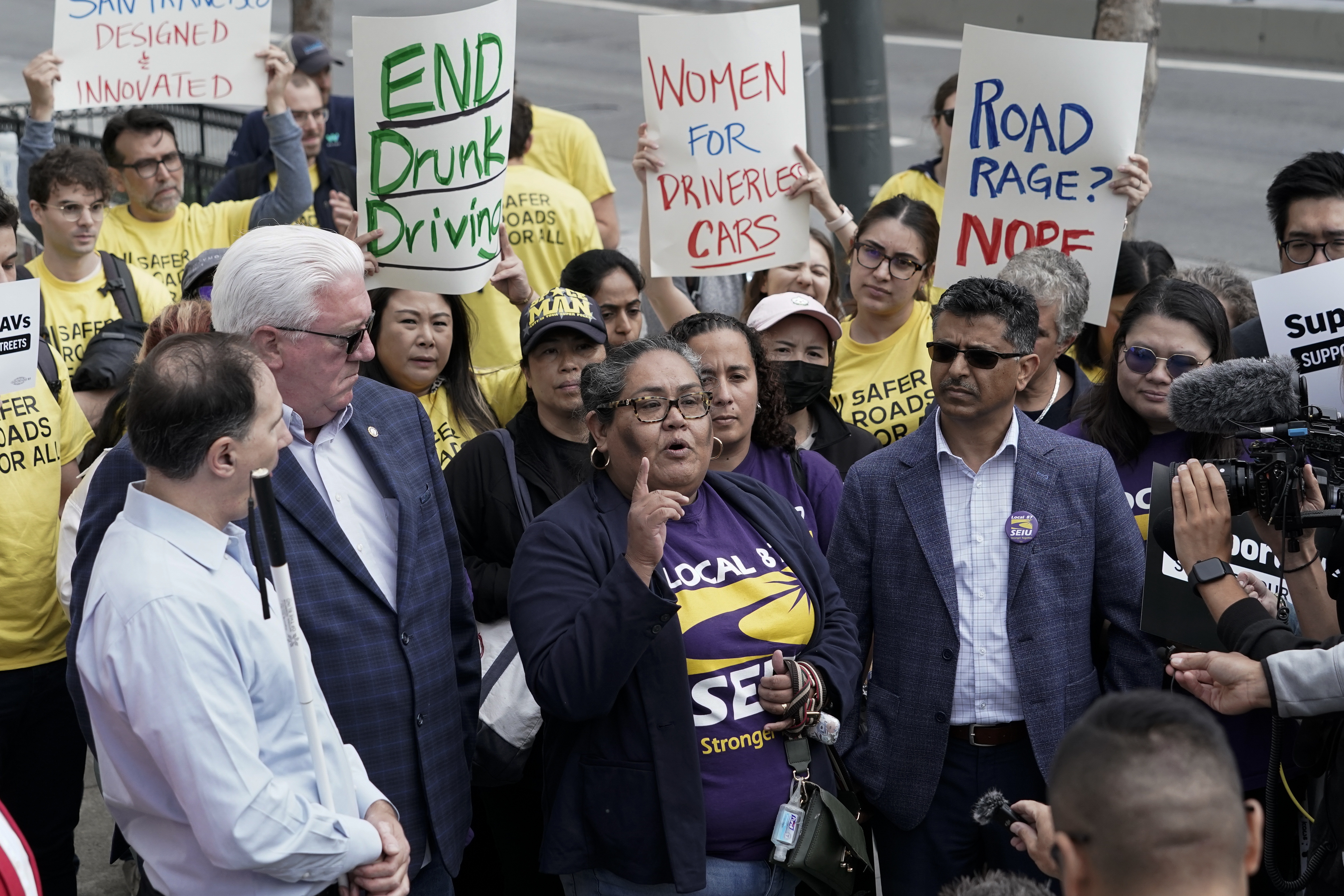 SEIU Local 87 president Olga Miranda, center, speaks in support of a proposed robotaxi expansion on Thursday, Aug. 10, 2023, in San Francisco. (AP Photo/Godofredo A. Vásquez)