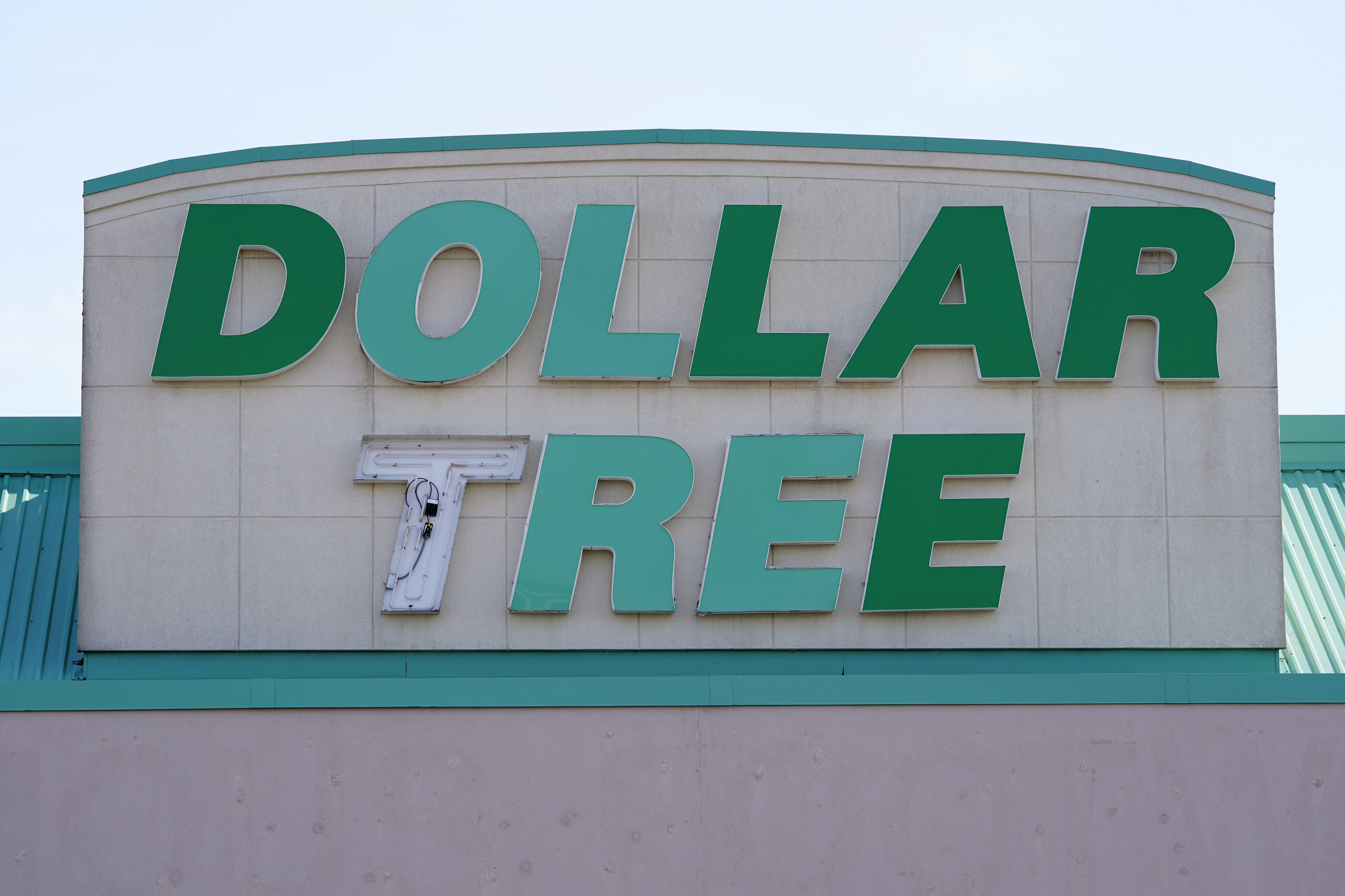 FILE - A sign hangs above a Dollar Tree store in Des Moines, Iowa. U.S. regulators on Wednesday, Aug. 23, 2023, have announced a settlement with the company that runs Dollar Tree and Family Dollar aimed at improving worker safety at thousands of the bargain stores across the country. (AP Photo/Charlie Neibergall, File)