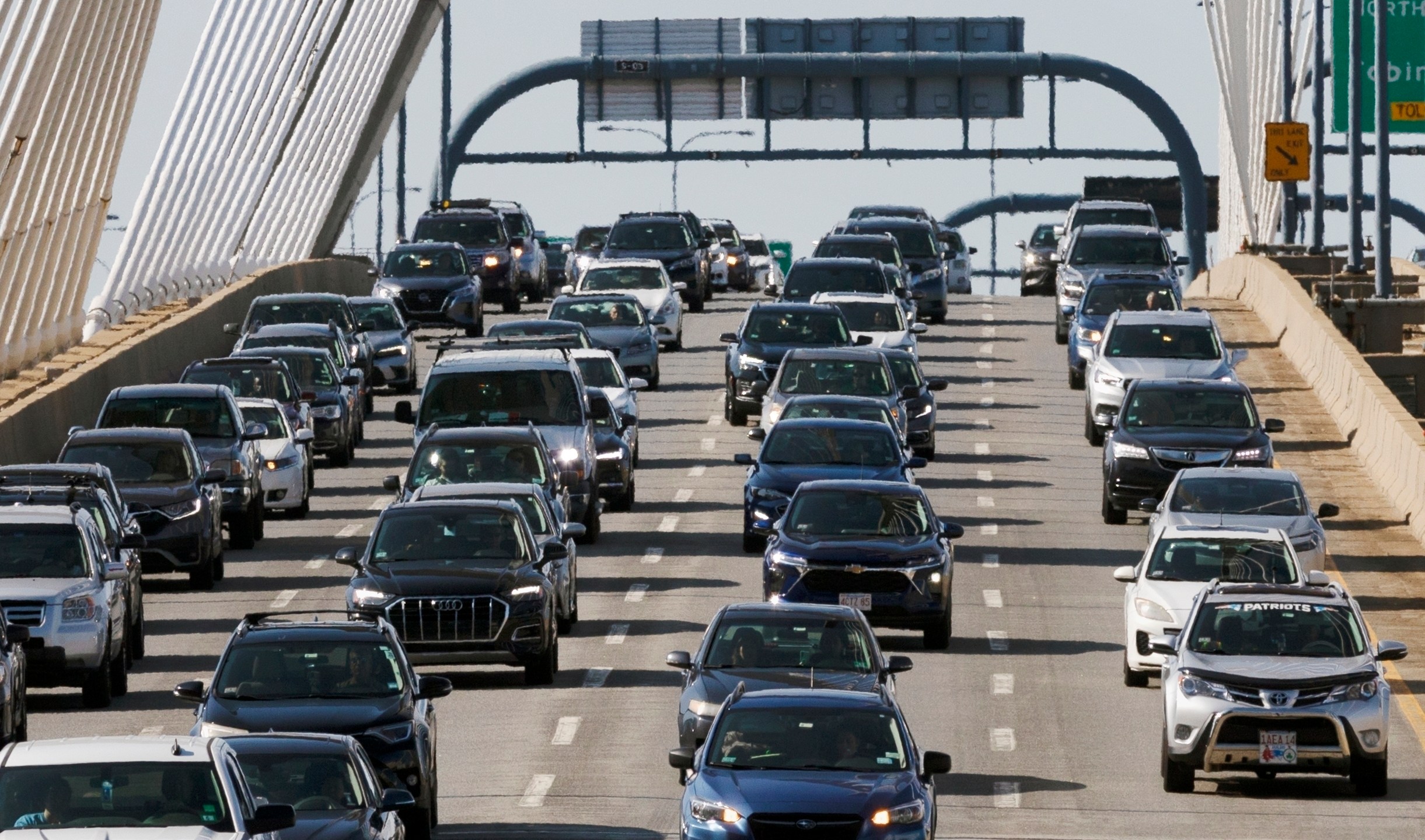 FILE - Heavy traffic heads south on Interstate 93 over the Zakim Bridge, Friday, Sep. 1, 2023, in Boston. Cars are getting an “F” in data privacy. A new study released Wednesday, Sept. 6, 2023, found that most major brands admit they may be selling your personal data, with half saying they will share it with the government or law enforcement without a court order. (AP Photo/Michael Dwyer, File)