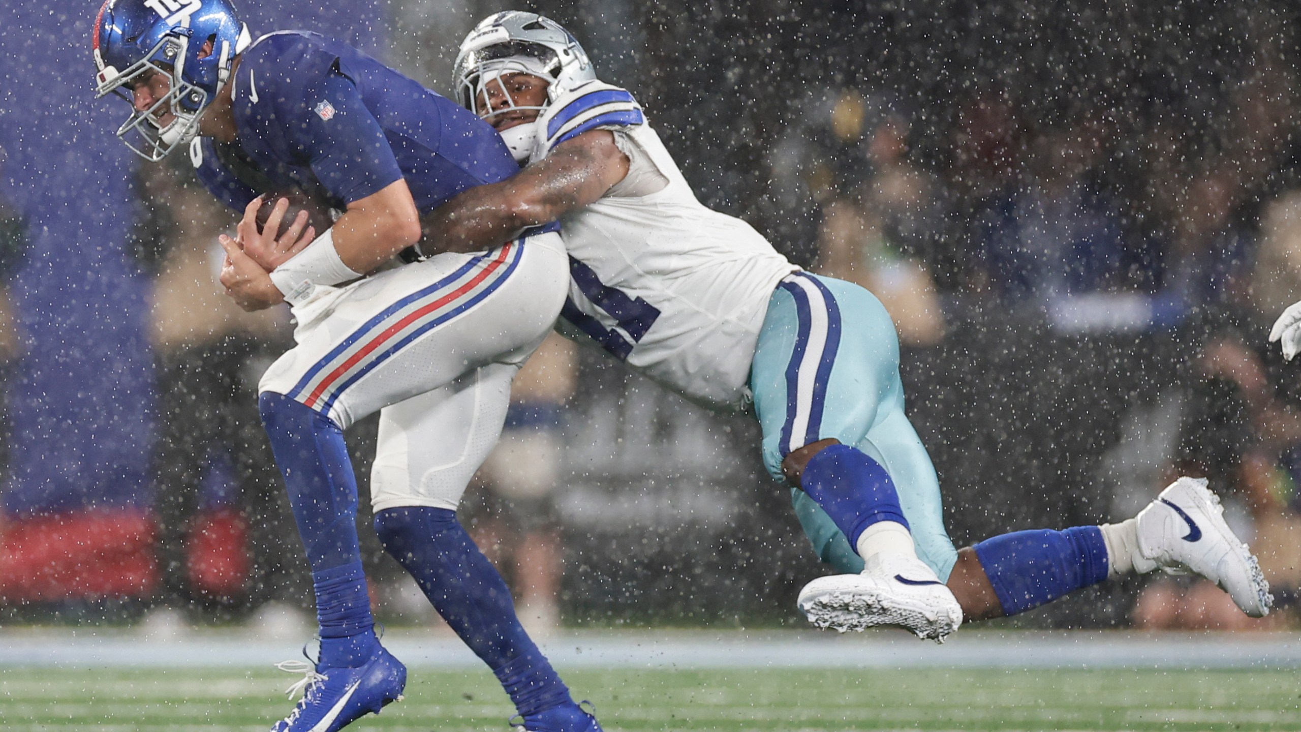 Dallas Cowboys' Micah Parsons, right, sacks New York Giants quarterback Daniel Jones during the second half of an NFL football game, Sunday, Sept. 10, 2023, in East Rutherford, N.J. (AP Photo/Adam Hunger)