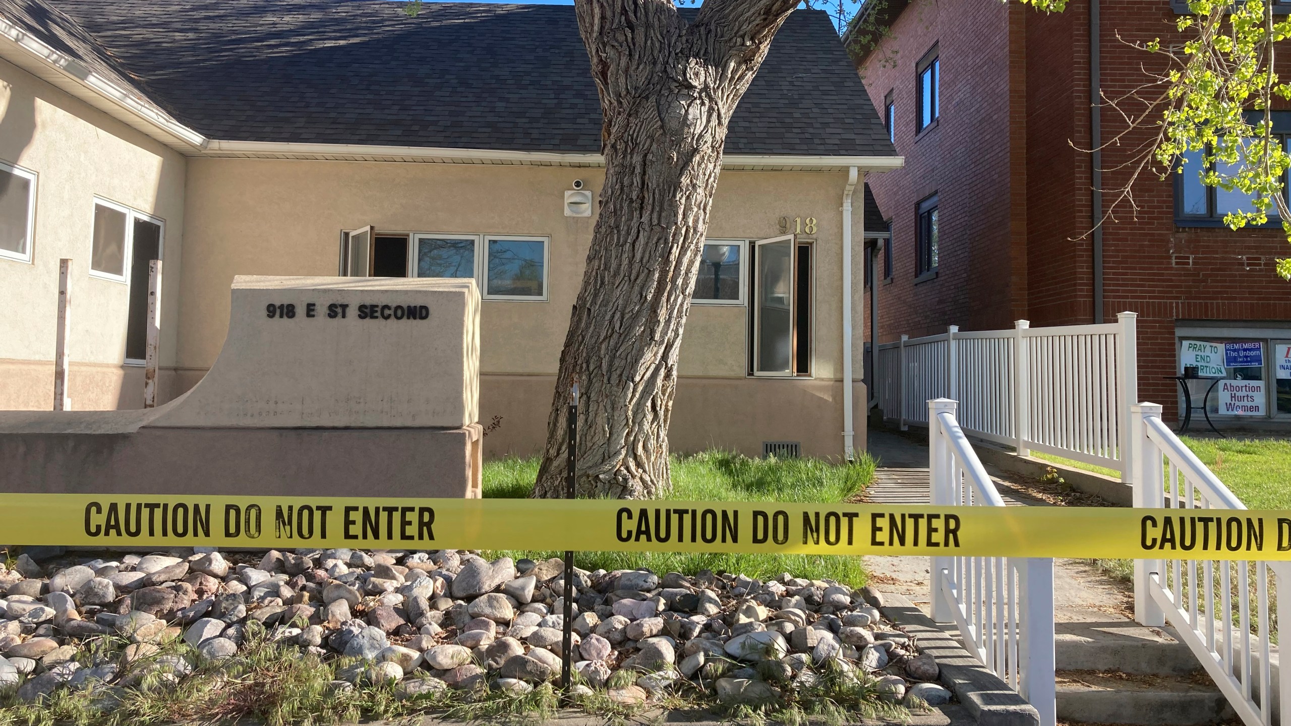 FILE - The fire-damaged Wellspring Health Access clinic is cordoned by tape, May 25, 2022, in Casper, Wyo. Lorna Roxanne Green, who says anxiety and nightmares led her to set fire to Wyoming’s only full-service abortion clinic is scheduled to be sentenced Thursday, Sept. 28, 2023. (AP Photo/Mead Gruver, File)