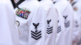 FILE - Enlisted sailors line up and wait to march on the field at Sun Life Stadium before the NFL football game in Miami, Nov. 13, 2011, between the Washington Redskins and Miami Dolphins. The Navy will begin randomly testing its special operations forces for steroids and other performance-enhancing drugs beginning in November, taking a groundbreaking step that military leaders have long resisted. Rear Adm. Keith Davids, commander of Naval Special Warfare Command, announced the new program Friday, Sept. 29, 2023, in a message to his force, calling it necessary to protect their health, safety and military readiness. (AP Photo/J Pat Carter, File)