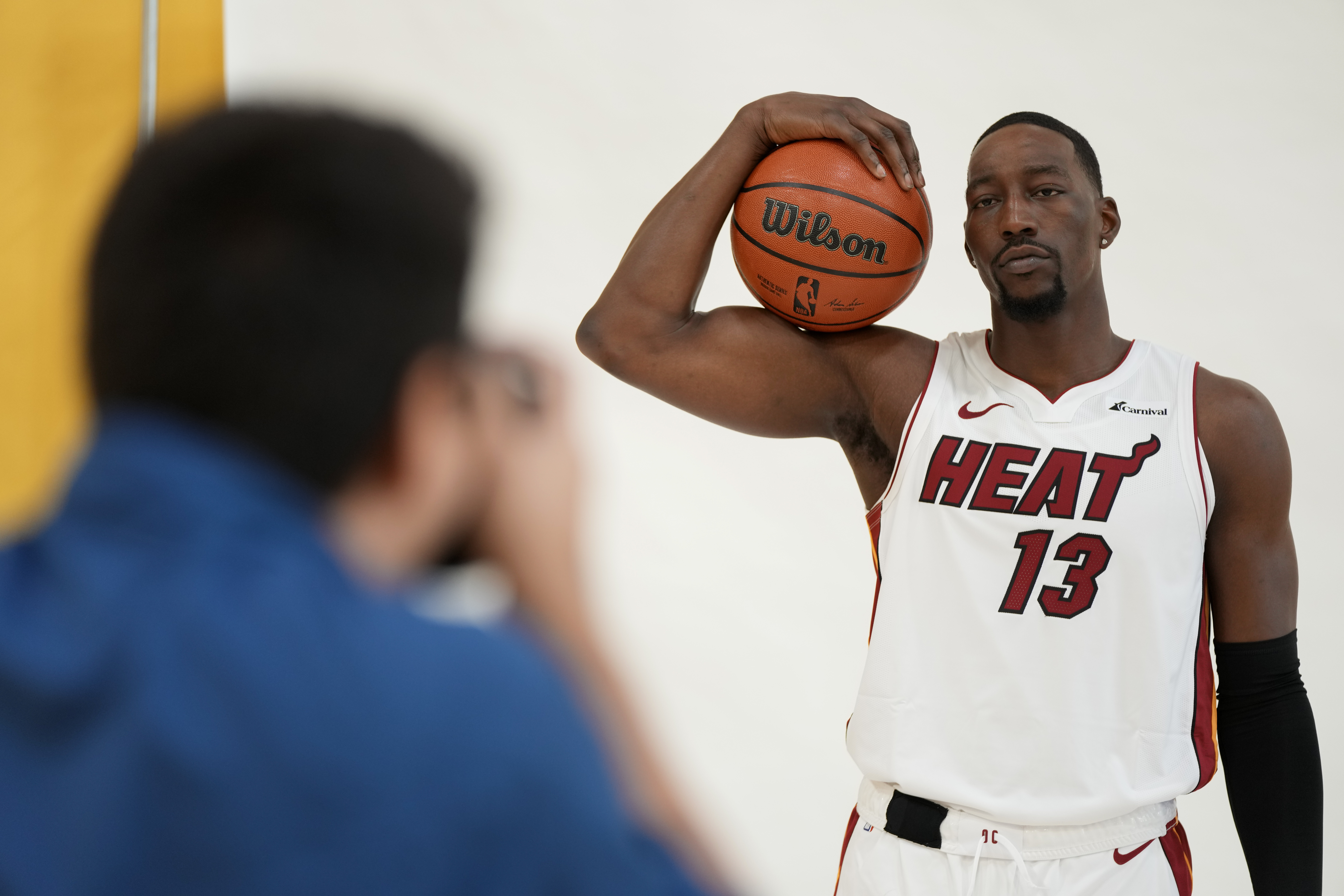 Miami Heat center Bam Adebayo (13) poses for portraits with a news photographer during the NBA basketball team's media day, in Miami, Monday, Oct. 2, 2023. (AP Photo/Rebecca Blackwell)