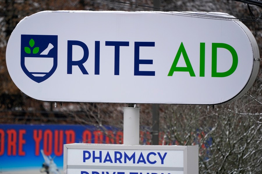 A Rite Aid sign stands in front of one of the drugstore's locations in Pittsburgh on Monday, Jan. 23, 2023. Rite Aid’s plan to close more stores as part of its bankruptcy process raises concern about how that might hurt access to medicine and care. The drugstore chain said late Sunday, Oct. 15, that its voluntary Chapter 11 process will allow it to speed up its plan to close underperforming stores. (AP Photo/Gene J. Puskar)