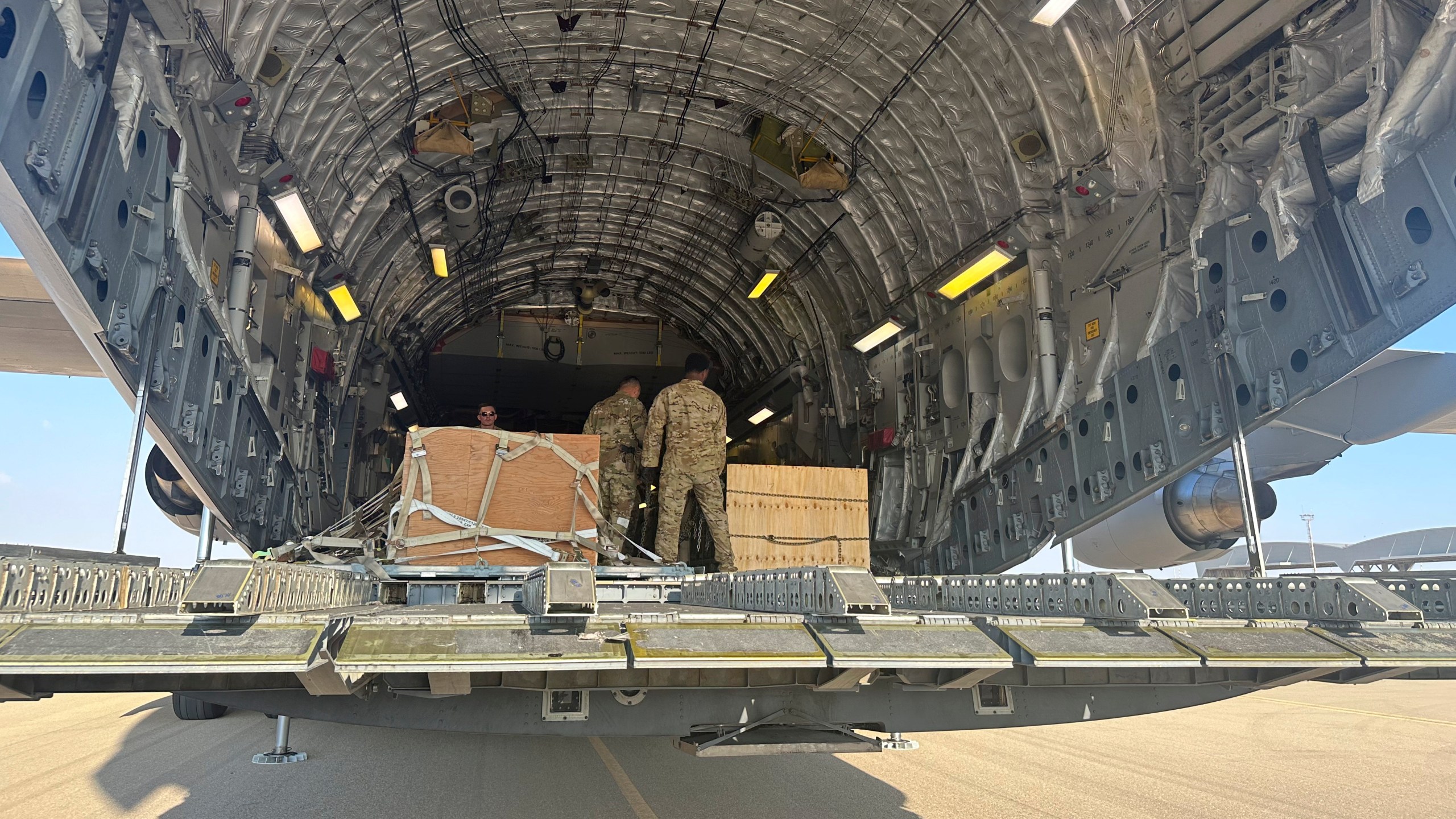 A U.S. C-17 sits at the Nevatim Air Base in the desert in Israel, Friday, Oct. 13, 2023. The aircraft arrived Friday with crates of American munitions for Israel. U.S. Defense Secretary Lloyd Austin, the second high-level U.S. official sent by President Joe Biden to visit Israel in two days, visited the base Friday afternoon and saw firsthand some of the weapons and security assistance that Washington rapidly delivered to Israel after it was attacked. (AP Photos/Lolita Baldor)