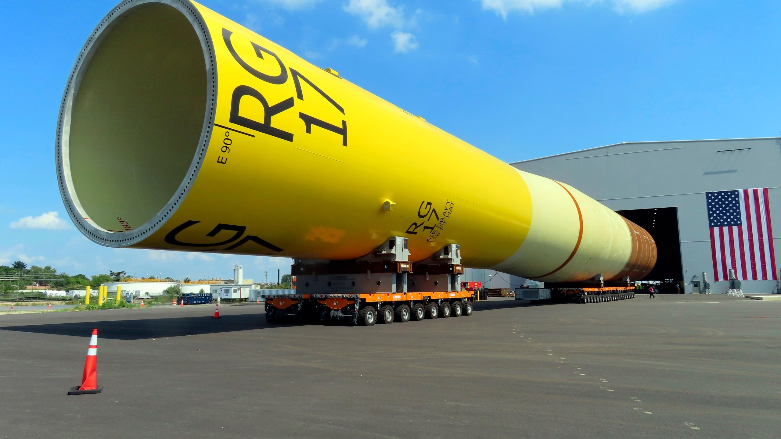 FILE - A huge foundation for an Orsted offshore wind turbine, called a monopile, sits atop wheeled movers in Paulsboro, N.J., July 6, 2023. The Danish wind energy developer Ørsted said it's scrapping its Ocean Wind I and II projects off southern New Jersey due to problems with supply chains, higher interest rates and a failure to obtain desired tax credits. (AP Photo/Wayne Parry, File)