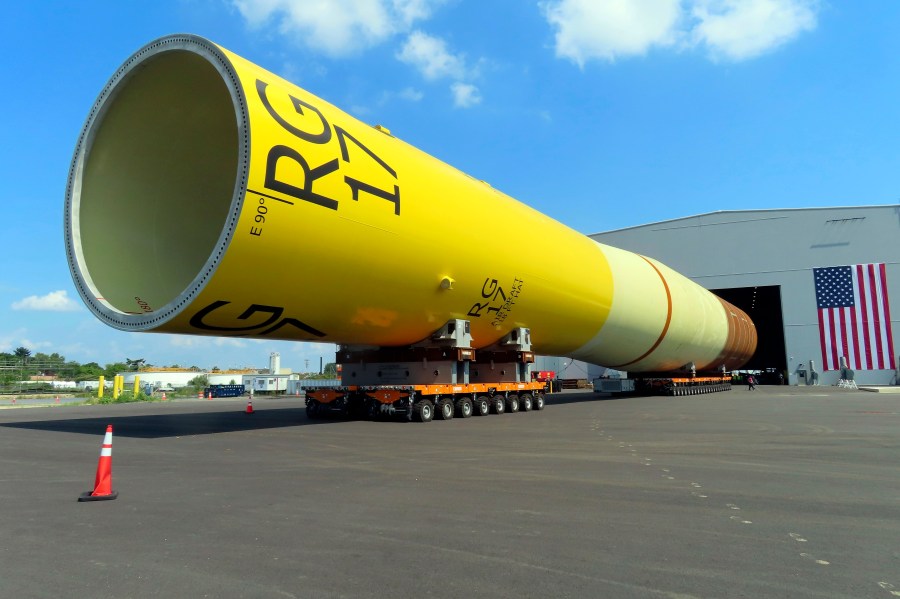 FILE - A huge foundation for an Orsted offshore wind turbine, called a monopile, sits atop wheeled movers in Paulsboro, N.J., July 6, 2023. The Danish wind energy developer Ørsted said it's scrapping its Ocean Wind I and II projects off southern New Jersey due to problems with supply chains, higher interest rates and a failure to obtain desired tax credits. (AP Photo/Wayne Parry, File)