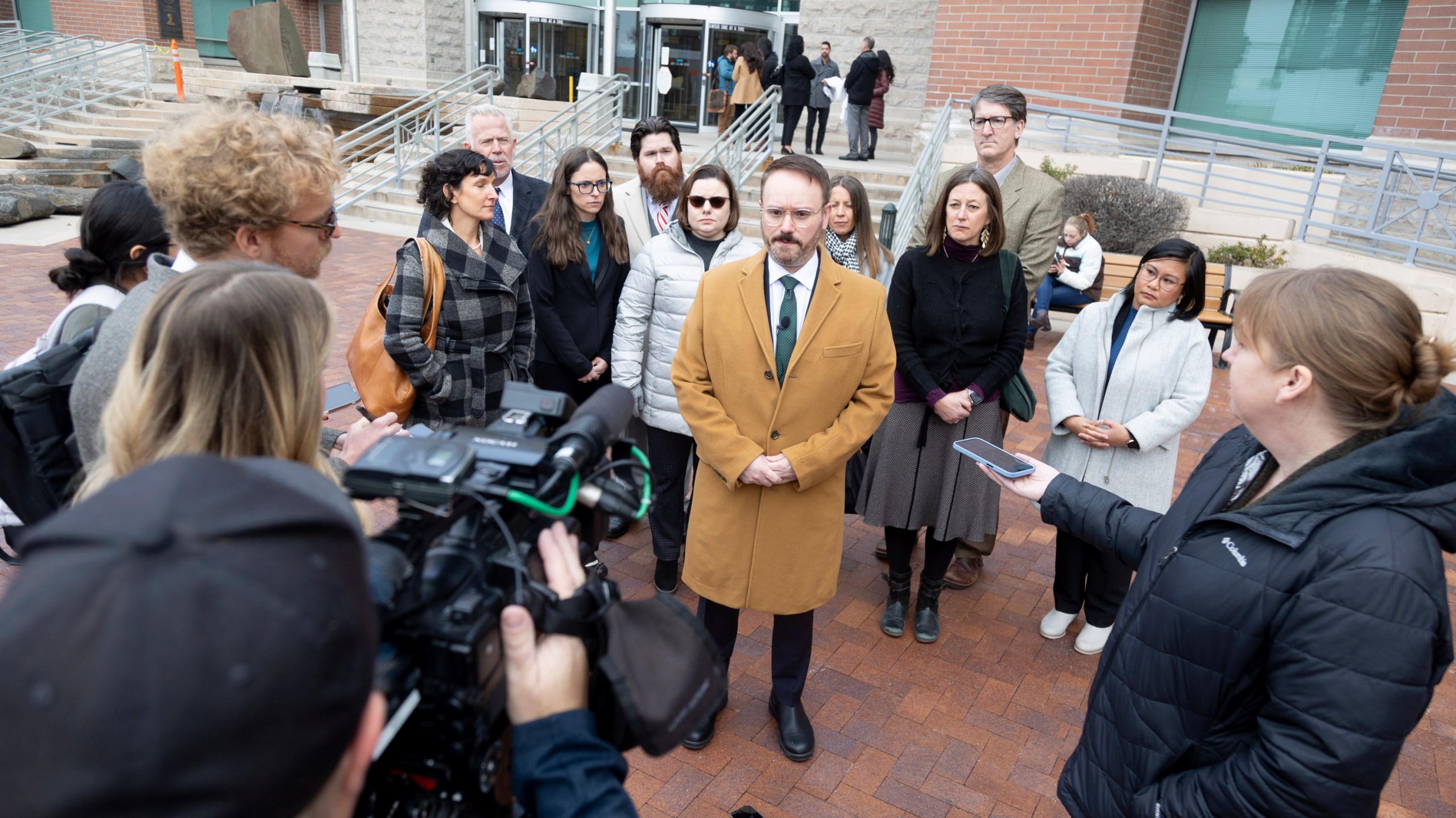 Marc Hearron, Senior Counsel at Center for Reproductive Rights stands outside the Ada County Courthouse, Thursday, Dec. 14, 2023 in Boise, Idaho with plaintiffs in abortion rights access case. An attorney for Idaho asked a judge on Thursday to throw out a lawsuit seeking clarity about the medical exemptions to the state's broad abortion bans, saying it was based on hypothetical situations rather than current facts. (AP Photo/Kyle Green)