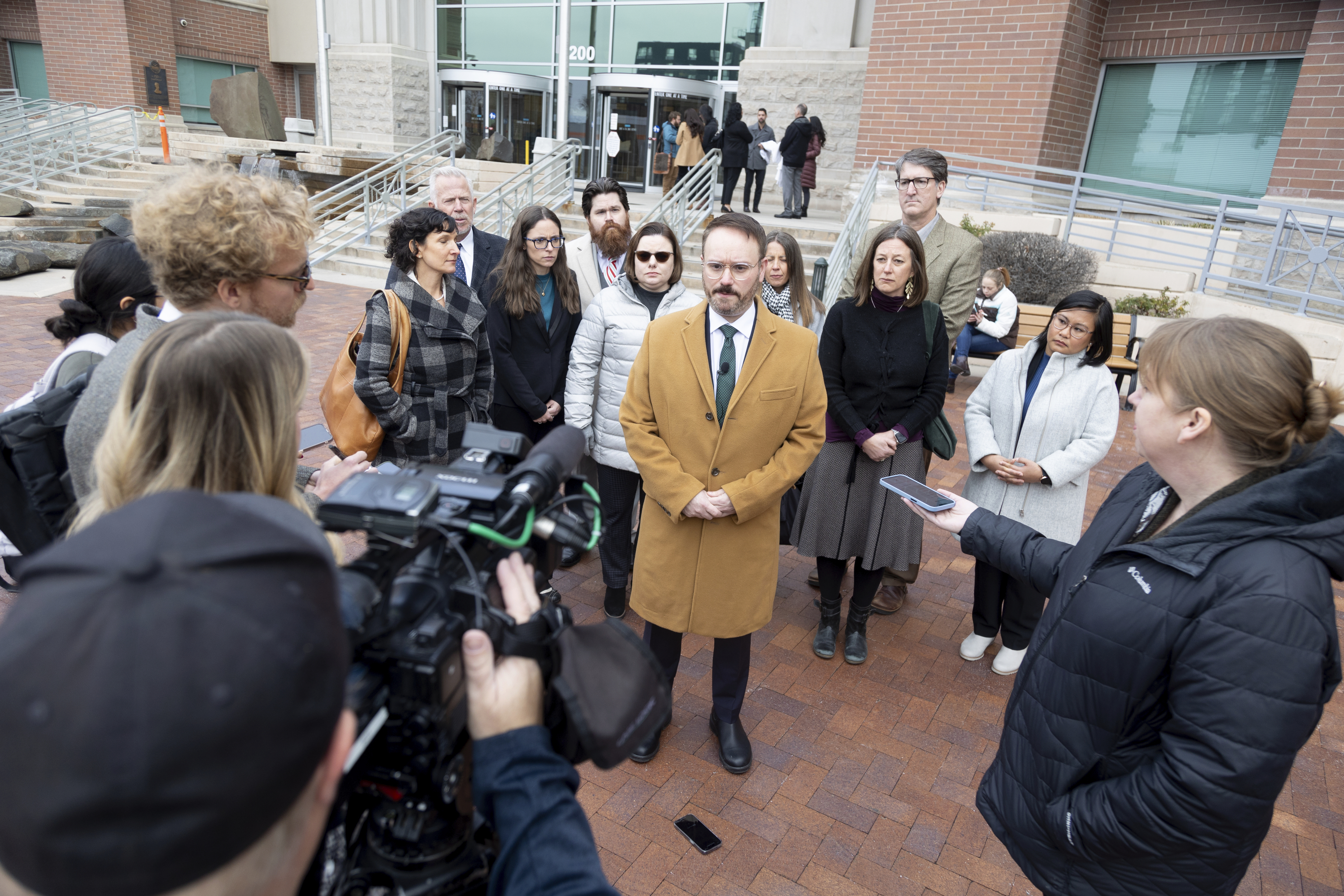 Marc Hearron, Senior Counsel at Center for Reproductive Rights stands outside the Ada County Courthouse, Thursday, Dec. 14, 2023 in Boise, Idaho with plaintiffs in abortion rights access case. An attorney for Idaho asked a judge on Thursday to throw out a lawsuit seeking clarity about the medical exemptions to the state's broad abortion bans, saying it was based on hypothetical situations rather than current facts. (AP Photo/Kyle Green)