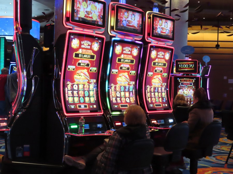 Gamblers play slot machines at the Ocean Casino Resort in Atlantic City, N.J. on Nov. 29, 2023. Internet gambling and sports betting both set new records in November as gamblers continue to take advantage of more options in addition to traveling to physical casinos in order to wager. (AP Photo/Wayne Parry)