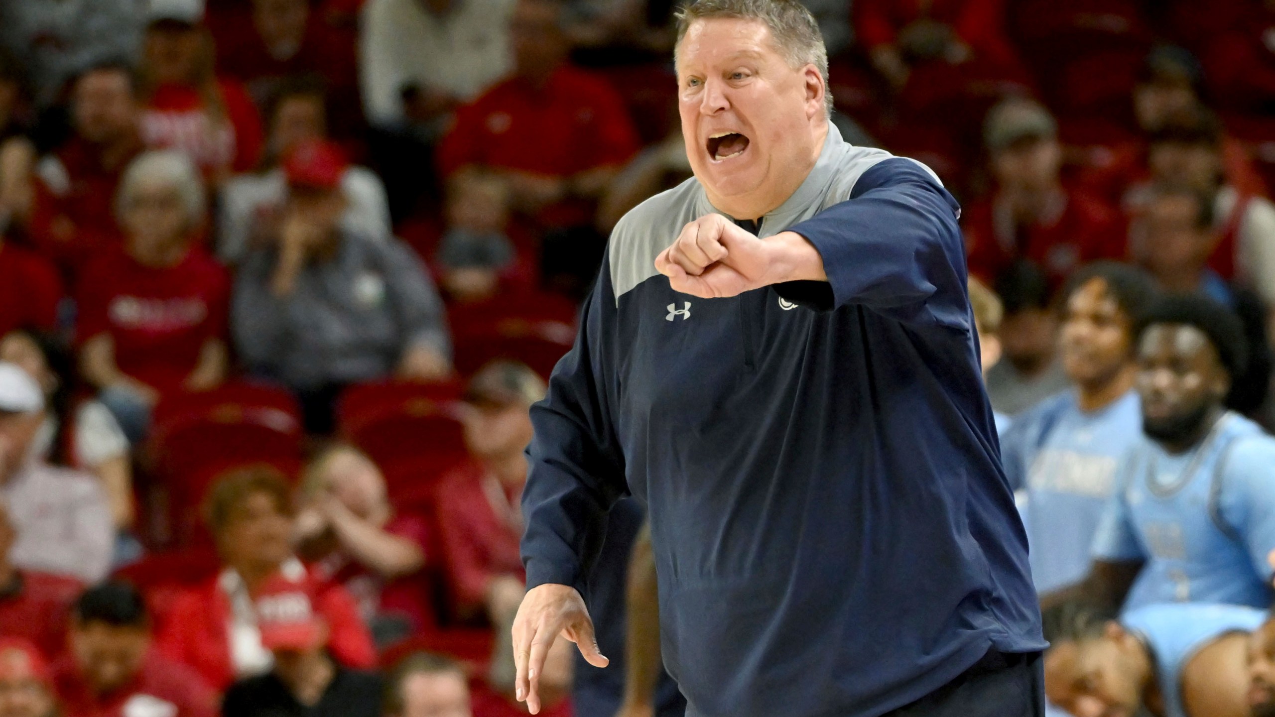 FILE - Old Dominion coach Jeff Jones reacts after a call during the second half of the team's NCAA college basketball game against Arkansas, Nov. 13, 2023, in Fayetteville, Ark. Jones has been hospitalized in Honolulu after suffering a heart attack Wednesday, Dec. 20, the school said. “He is resting comfortably and expecting a full recovery,” Old Dominion said in a statement Thursday. The 63-year-old Jones is being held for observation and will not be available to coach in the Diamond Head Classic. (AP Photo/Michael Woods, File)