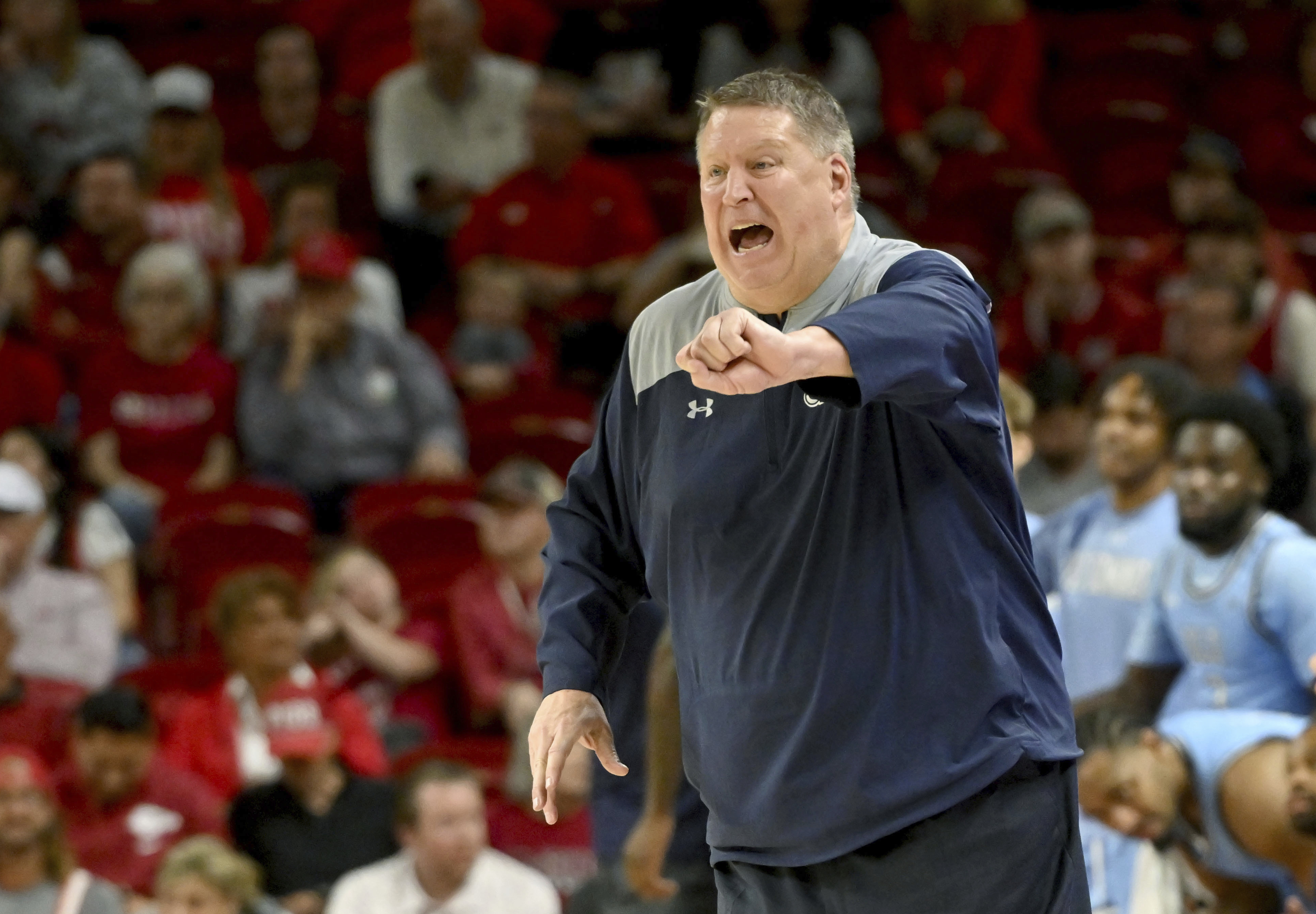 FILE - Old Dominion coach Jeff Jones reacts after a call during the second half of the team's NCAA college basketball game against Arkansas, Nov. 13, 2023, in Fayetteville, Ark. Jones has been hospitalized in Honolulu after suffering a heart attack Wednesday, Dec. 20, the school said. “He is resting comfortably and expecting a full recovery,” Old Dominion said in a statement Thursday. The 63-year-old Jones is being held for observation and will not be available to coach in the Diamond Head Classic. (AP Photo/Michael Woods, File)