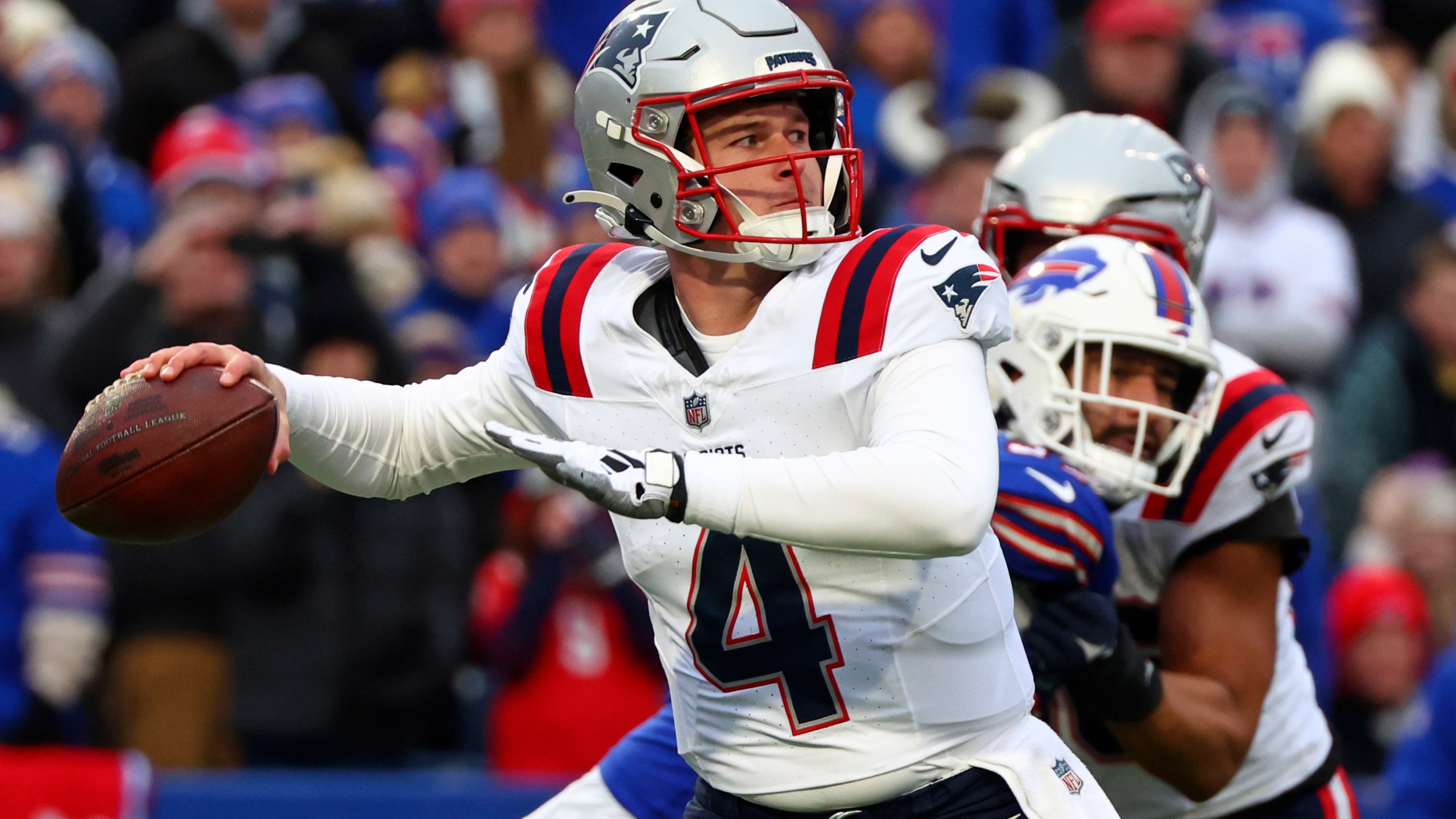 New England Patriots quarterback Bailey Zappe (4) throws a pass during the first half of an NFL football game against the Buffalo Bills in Orchard Park, N.Y., Sunday, Dec. 31, 2023. (AP Photo/Jeffrey T. Barnes )