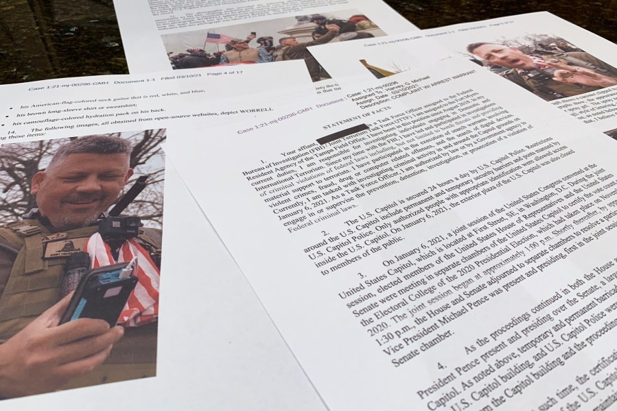 FILE - This photo shows part of the Justice Department's statement of facts in the complaint and arrest warrant for Christopher Worrell. Worrell, a member of the Proud Boys extremist group who went on the run after he was convicted of assaulting police with pepper spray in the Jan. 6 attack at the U.S. Capitol and then allegedly faked a drug overdose after he was caught was sentenced to 10 years in prison on Thursday, Jan. 4, 2024. (AP Photo/Jon Elswick, File)