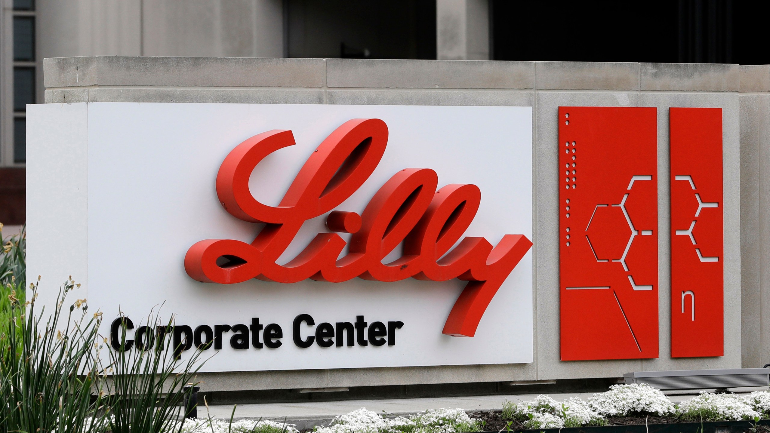 FILE - A sign for Eli Lilly & Co. stands outside their corporate headquarters in Indianapolis on April 26, 2017. Eli Lilly has launched a unique website to connect U.S. patients seeking obesity treatment to doctors, dieticians and its new weight-loss drug, Zepbound. The drugmaker said Thursday, Jan 4, 2024, it will use the site, called LillyDirect, to pair visitors with third-party mail-order pharmacies for prescriptions and to care providers through a virtual medical weight-loss clinic. (AP Photo/Darron Cummings, File) (AP Photo/Darron Cummings, File)