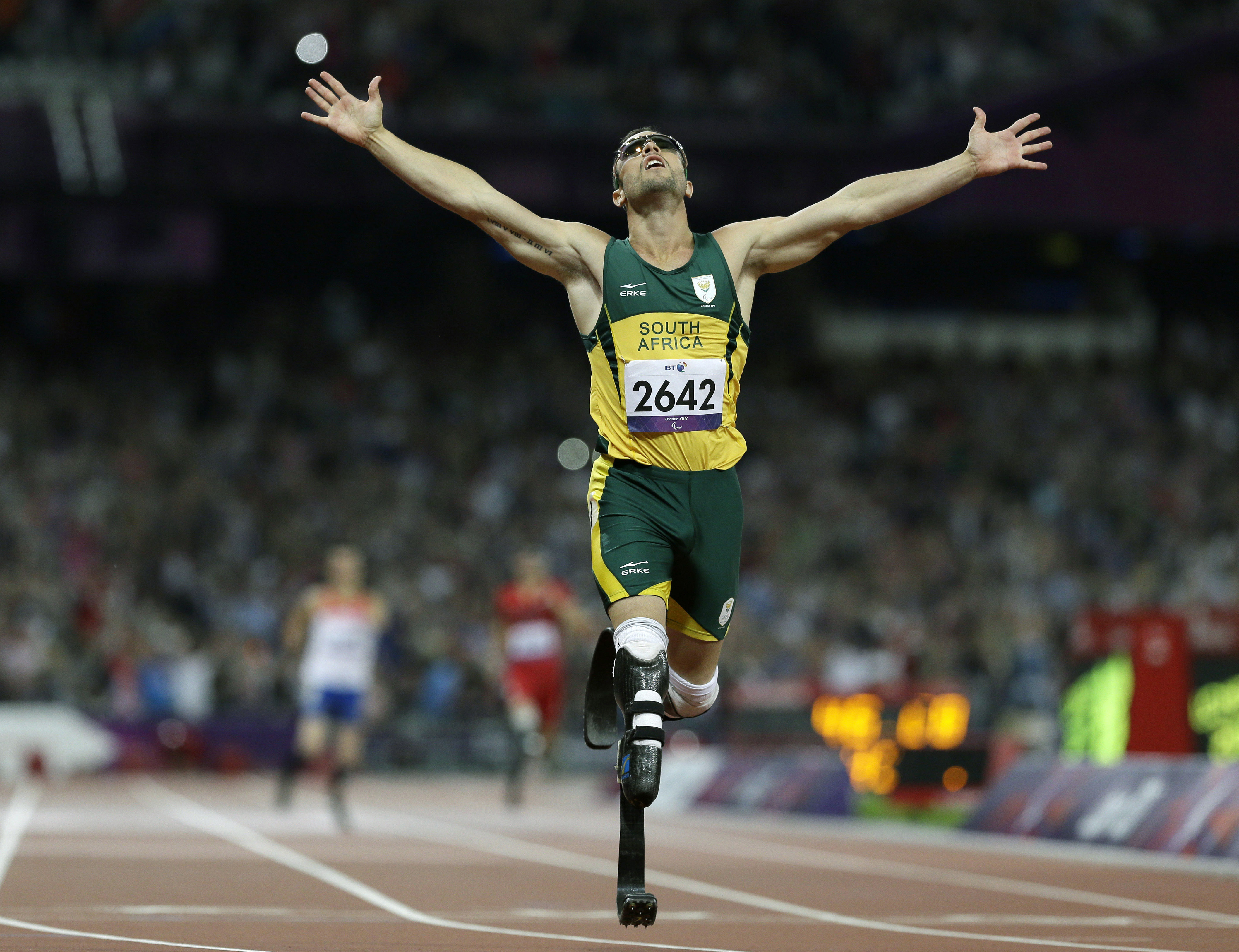 FILE - South Africa's Oscar Pistorius wins gold in the men's 400-meter T44 final at the 2012 Paralympics in London on Sept. 8, 2012. Oscar Pistorius is due on Friday, Jan. 5, 2024 to be released from prison on parole to live under strict conditions at a family home after serving nearly nine years of his murder sentence for the shooting death of girlfriend Reeva Steenkamp on Valentine’s Day 2013. (AP Photo/Kirsty Wigglesworth, File)