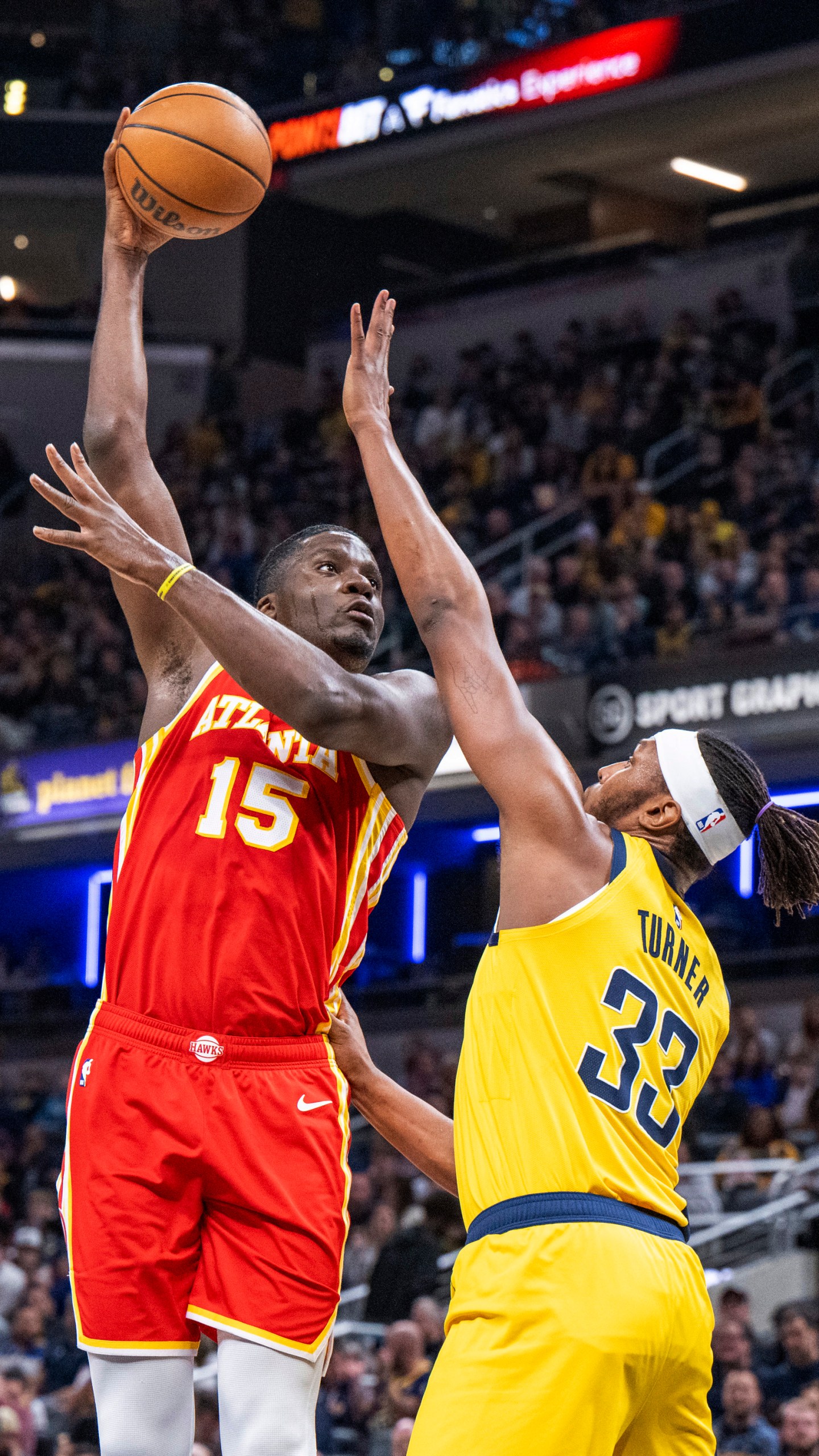 Atlanta Hawks center Clint Capela (15) shoots while being defended by Indiana Pacers center Myles Turner (33) during the first half of an NBA basketball game in Indianapolis, Friday, Jan. 5, 2024. (AP Photo/Doug McSchooler)