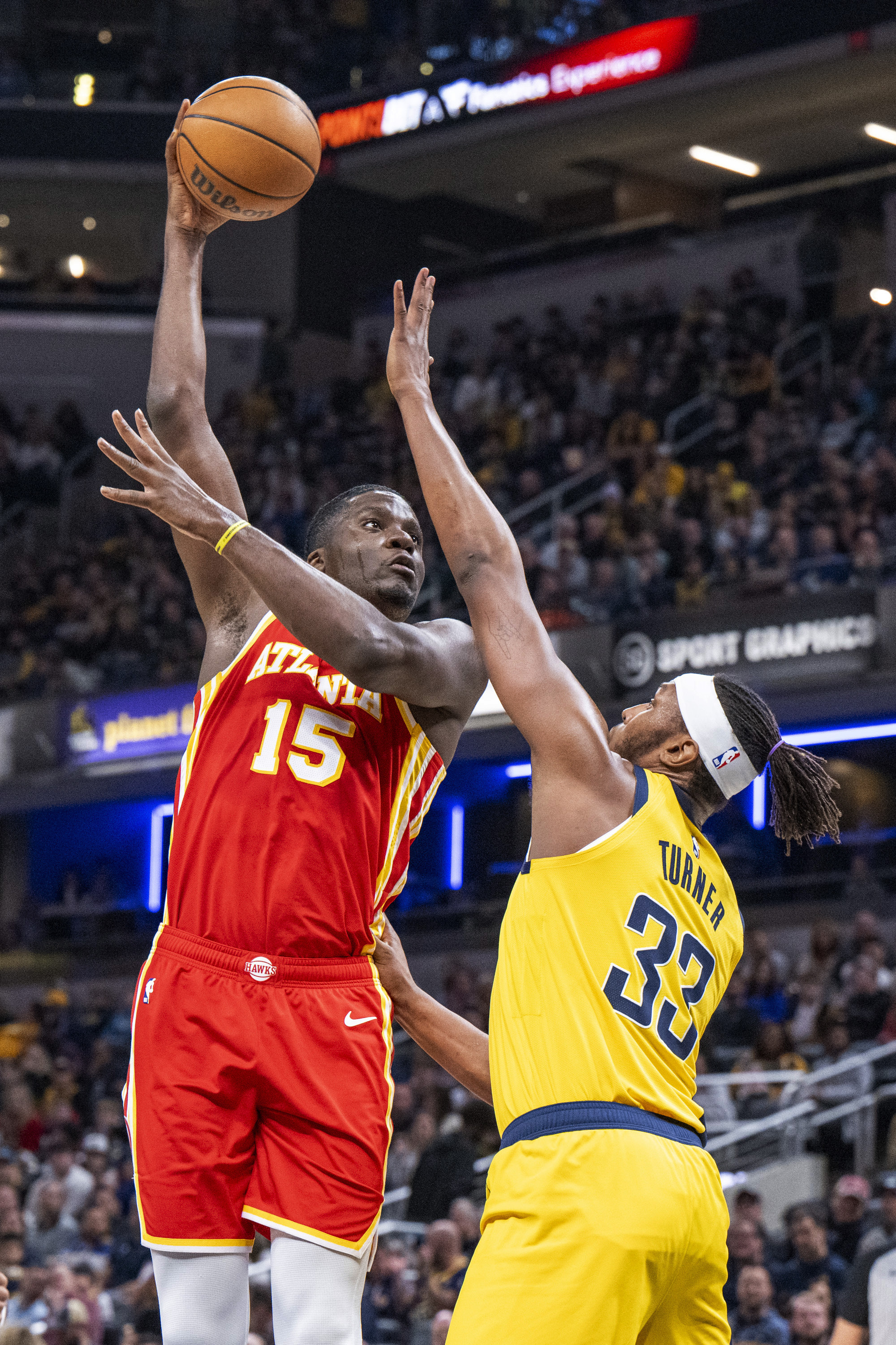 Atlanta Hawks center Clint Capela (15) shoots while being defended by Indiana Pacers center Myles Turner (33) during the first half of an NBA basketball game in Indianapolis, Friday, Jan. 5, 2024. (AP Photo/Doug McSchooler)