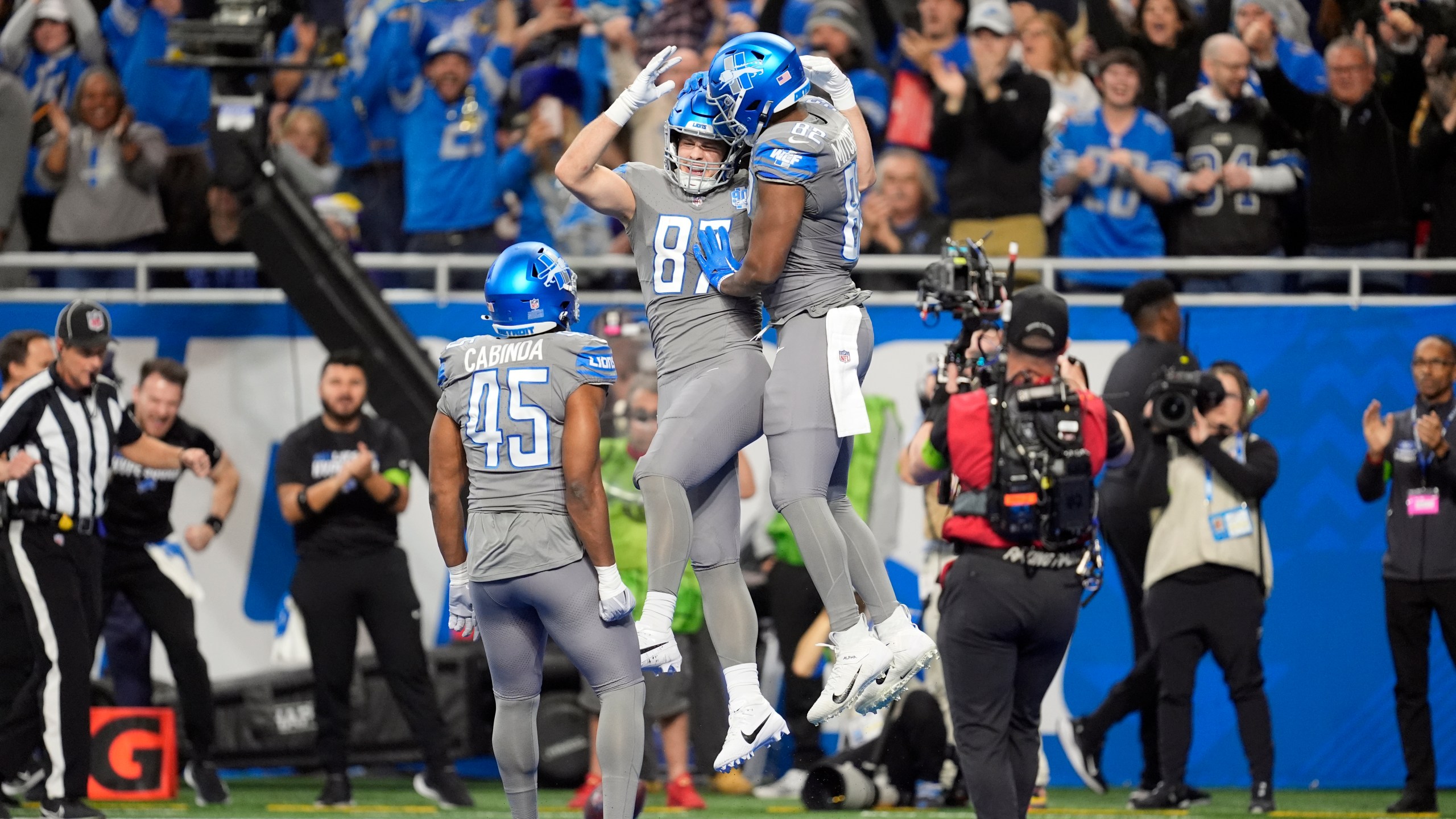 Detroit Lions tight end Sam LaPorta (87) is congrautalted by tight end James Mitchell (82) after LaPorta's 2-yard touchdown reception during the first half of an NFL football game against the Minnesota Vikings, Sunday, Jan. 7, 2024, in Detroit. (AP Photo/Paul Sancya)