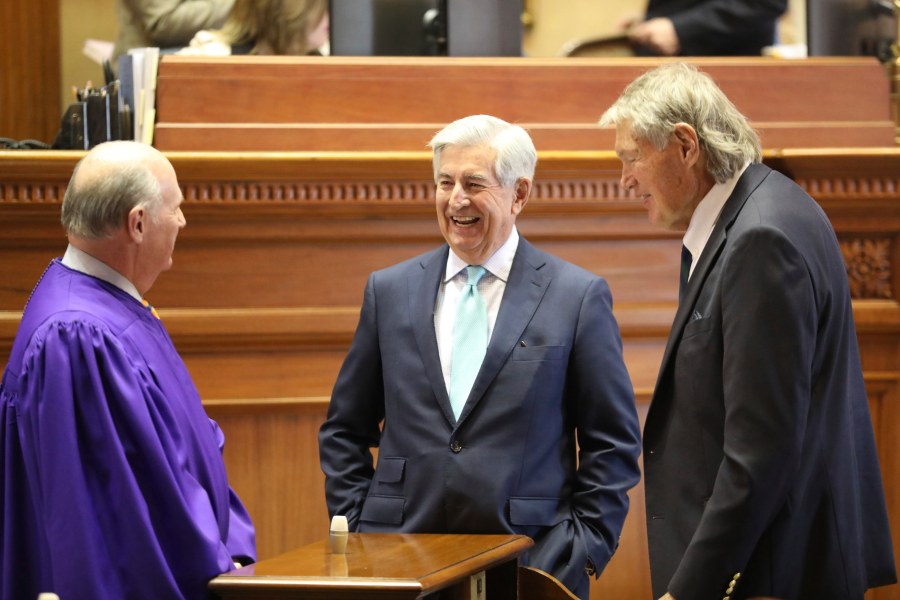 South Carolina Sen. Nikki Setzler, D-West Columbia, center, talks to Senate President Thomas Alexander, R-Walhalla, left, and Sen. Harvey Peeler, R-Gaffney, right before the session begins on Wednesday, Jan. 10, 2024, in Columbia, South Carolina. Setzler is retiring after 48 years in the state Senate and is currently the longest serving state senator in the U.S. (AP Photo/Jeffrey Collins)