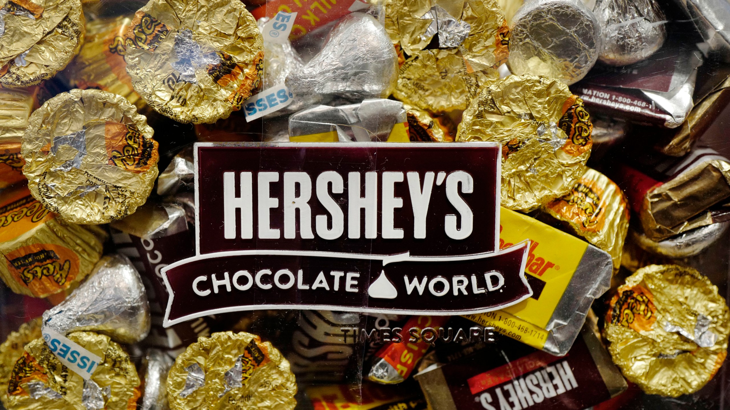 FILE - A mixture of Hershey's chocolates is displayed in the company's Times Square store, March 1, 2017, in New York. Hershey is cautioning on its 2024 profit growth as the company contends with rising cocoa costs that are leading to higher prices for chocolate. Cocoa futures prices have doubled over the past year and hit an unprecedented $5,874 per metric ton Friday, Feb. 9, 2024, in intraday trading. (AP Photo/Mark Lennihan, File)