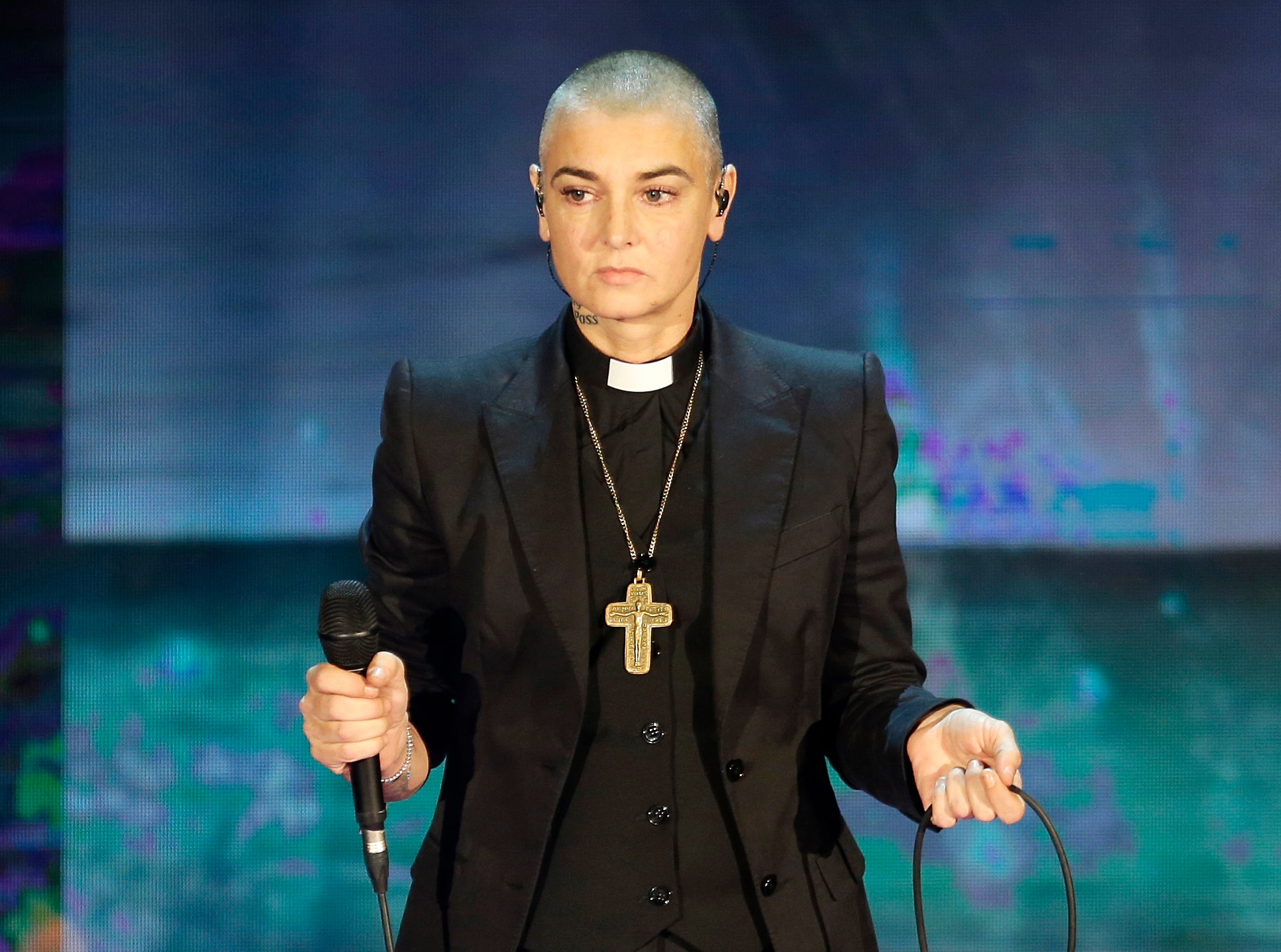 FILE - In this Oct. 5, 2014 file photo, Irish singer Sinead O'Connor performs during the Italian State RAI TV program "Che Tempo che Fa", in Milan, Italy. O'Connor, who died July 26, 2023, is among the 2024 nominees for induction into the Rock & Roll Hall of Fame. (AP Photo/Antonio Calanni, File)