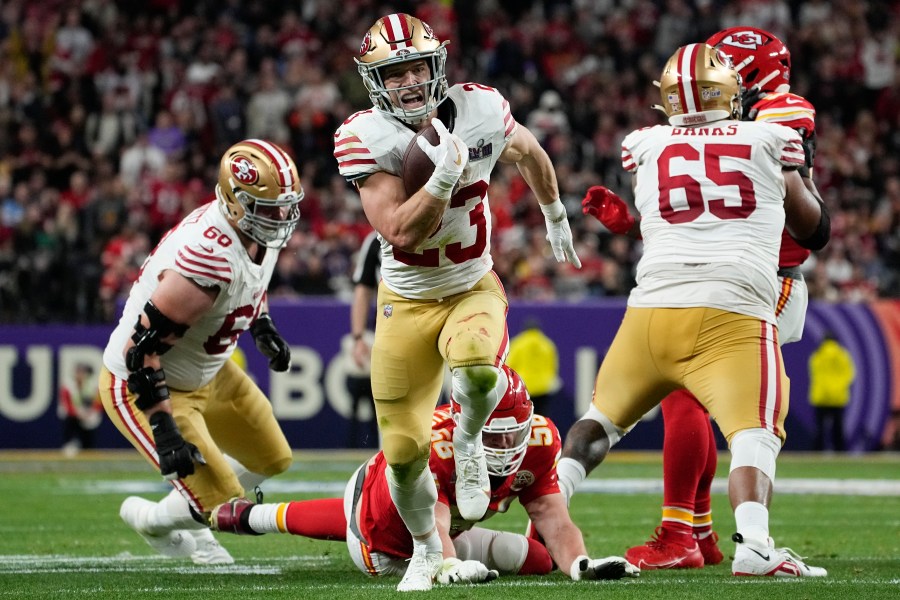 San Francisco 49ers running back Christian McCaffrey (23) runs into the end zone for a topuchdown against the Kansas City Chiefs during the first half of the NFL Super Bowl 58 football game Sunday, Feb. 11, 2024, in Las Vegas. (AP Photo/George Walker IV)