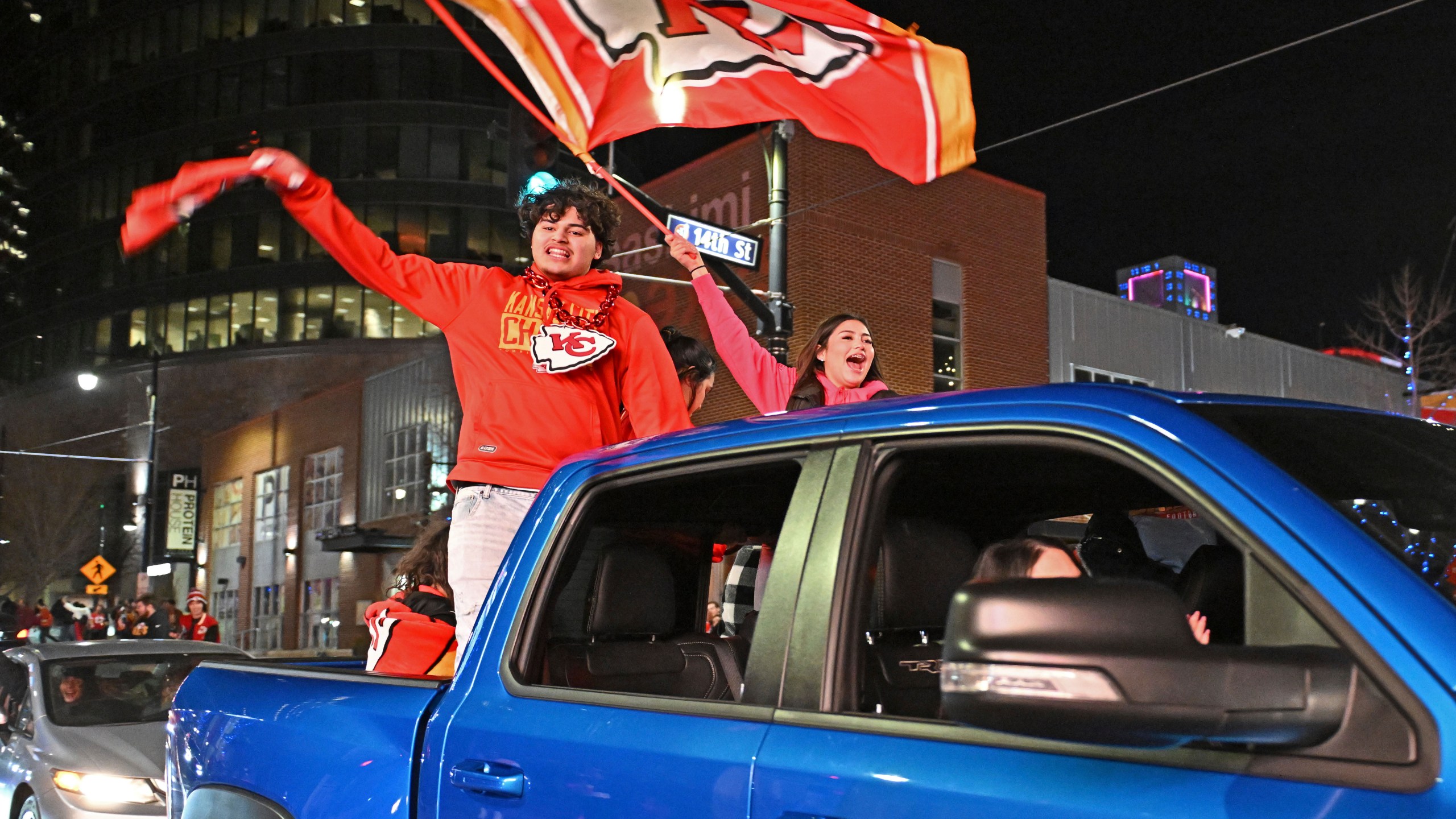 Kansas City Chiefs fans celebrate after the Chiefs beat the San Francisco 49ers in the Super Bowl, at the Power and Light District, Sunday, Feb. 11, 2024, in Kansas City, Mo. (AP Photo/Peter Aiken)