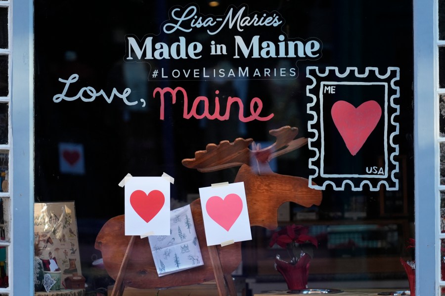 Valentine's Day hearts decorate a shop, Wednesday, Feb. 14, 2024, in Portland, Maine. The public has helped honor the memory of Kevin Fahrman, the Valentine's Day Bandit who secretly hung hundreds of red paper hearts throughout the city every February 14th. Farman died last year. (AP Photo/Robert F. Bukaty)