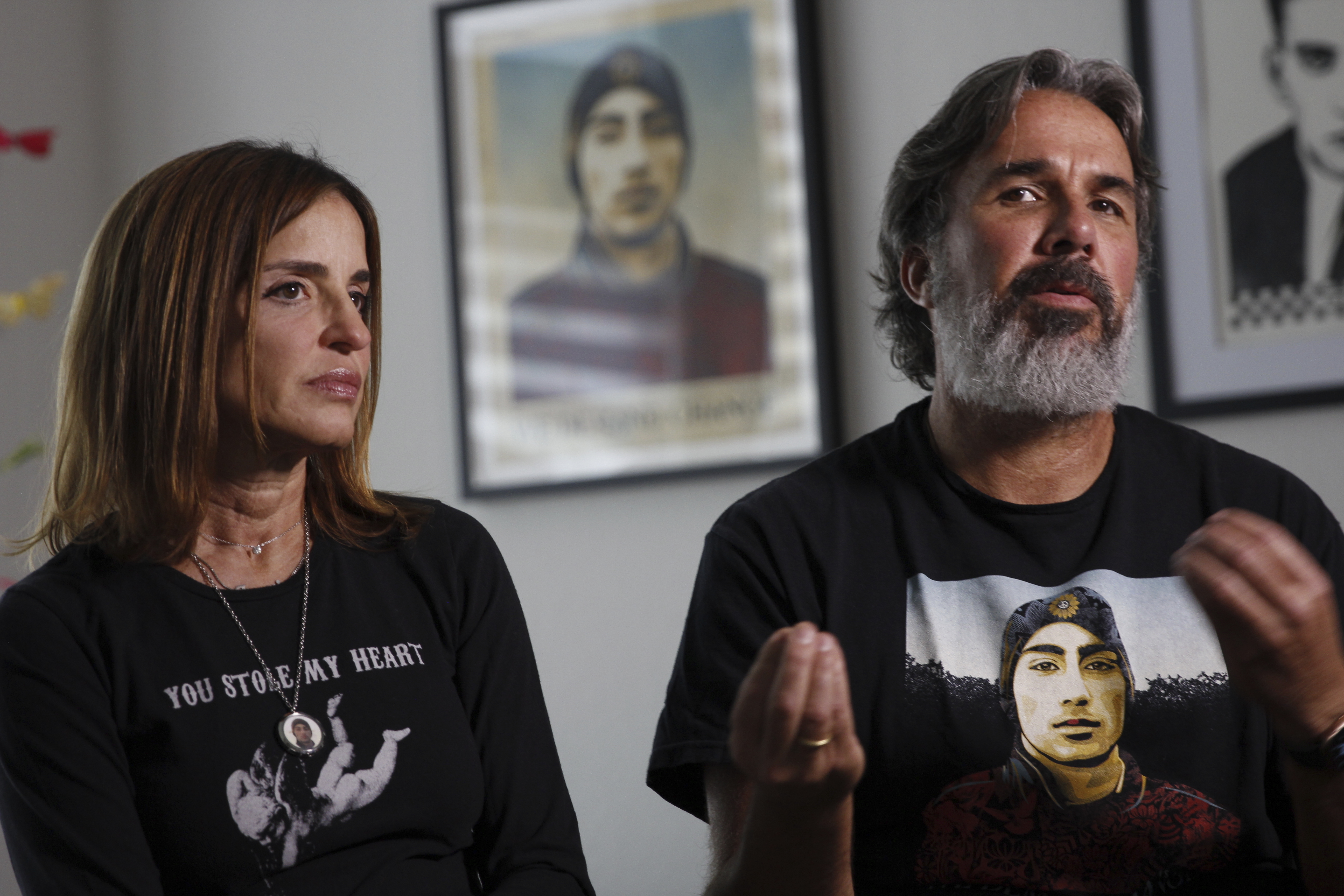 Manuel and Patricia Oliver, the parents of Joaquin Oliver, one of the victims of the 2018 mass shooting at Marjory Stoneman Douglas High School in Parkland, Fla., sit for an interview in Coral Springs, Fla., on Friday Feb. 9, 2024. The Olivers are launching a campaign where re-created voices of gun violence victims will call federal lawmakers. The recordings re-creating voices of victims from around the country are being robocalled to U.S. senators and House members who oppose stricter gun laws. (AP Photo/Cody Jackson)