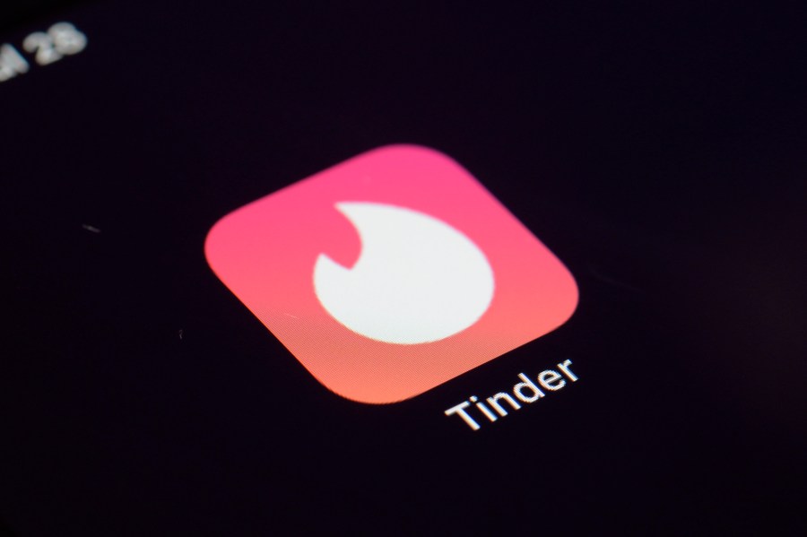 FILE - The icon for the dating app Tinder appears on a device, July 28, 2020, in New York. Tinder, Hinge and other dating apps are designed with addictive features that encourage “compulsive” use, a proposed class action lawsuit against parent company Match Group claims. The lawsuit filed Wednesday, Feb. 14, 2024, says Match intentionally designs its dating platforms with game-like features that “lock users into a perpetual pay-to-play loop” prioritizing profit over promises to help users find relationships. (AP Photo/Patrick Sison, File)