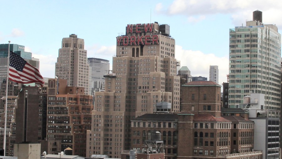 FILE - The New Yorker Hotel, center, is seen in New York, Nov. 8, 2013. A man who succeeded in using a New York City housing law to live rent-free in the iconic hotel has been charged with fraud after he claimed to own it. (AP Photo/Peter Morgan, File)