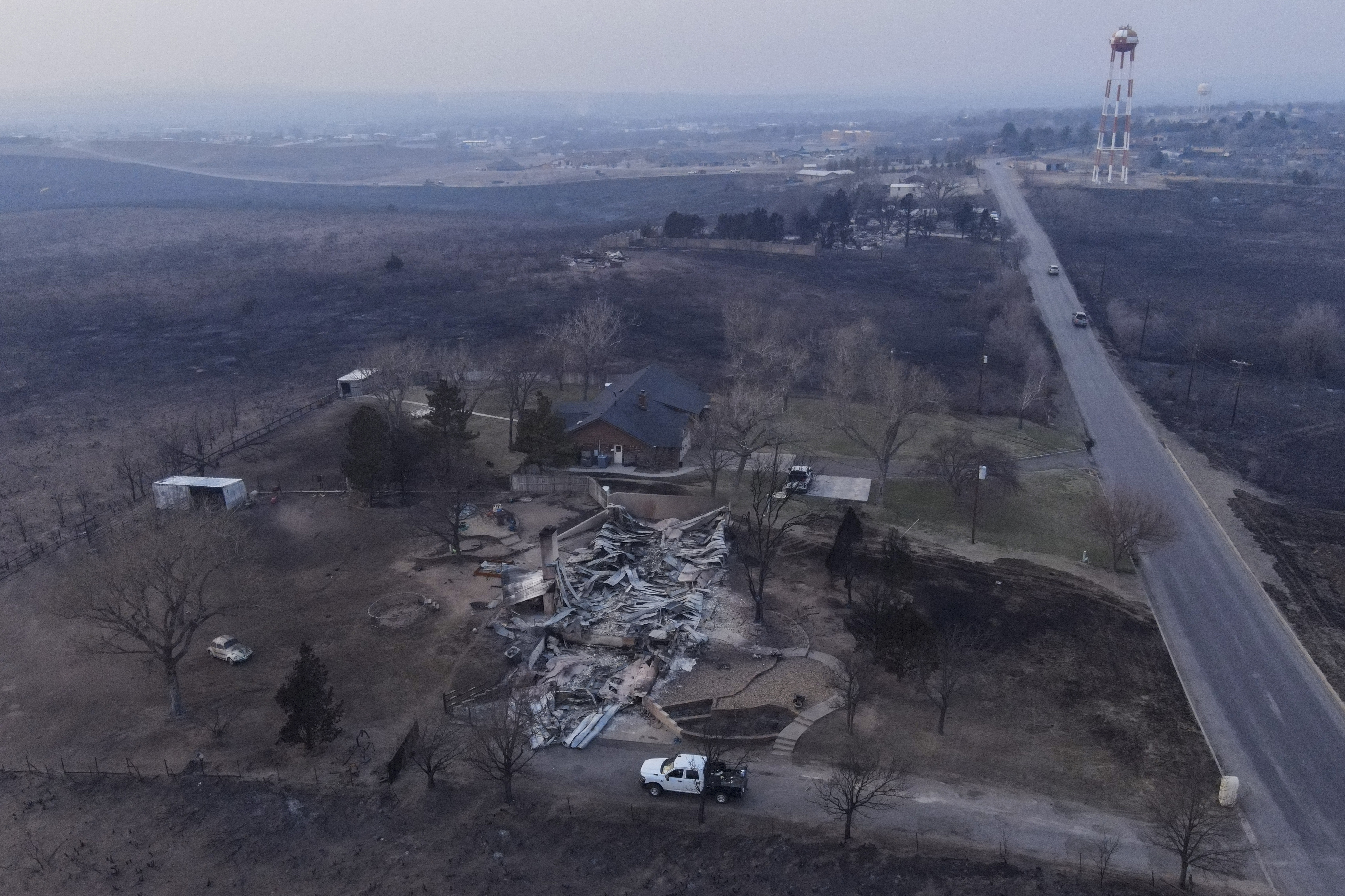 Damage to a property burned by the Smokehouse Creek Fire is seen Wednesday, Feb. 28, 2024, in Canadian, Texas. (AP Photo/Julio Cortez)