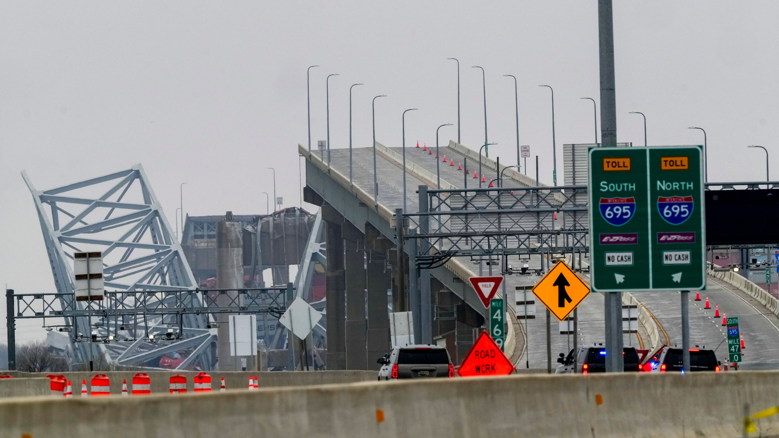 Shown is the wreckage of Francis Scott Key Bridge as seen from Dundalk, Md., on Wednesday, March 27, 2024, Recovery efforts resumed Wednesday for the construction workers who are presumed dead after the cargo ship hit a pillar of the bridge, causing the structure to collapse. (AP Photo/Matt Rourke)