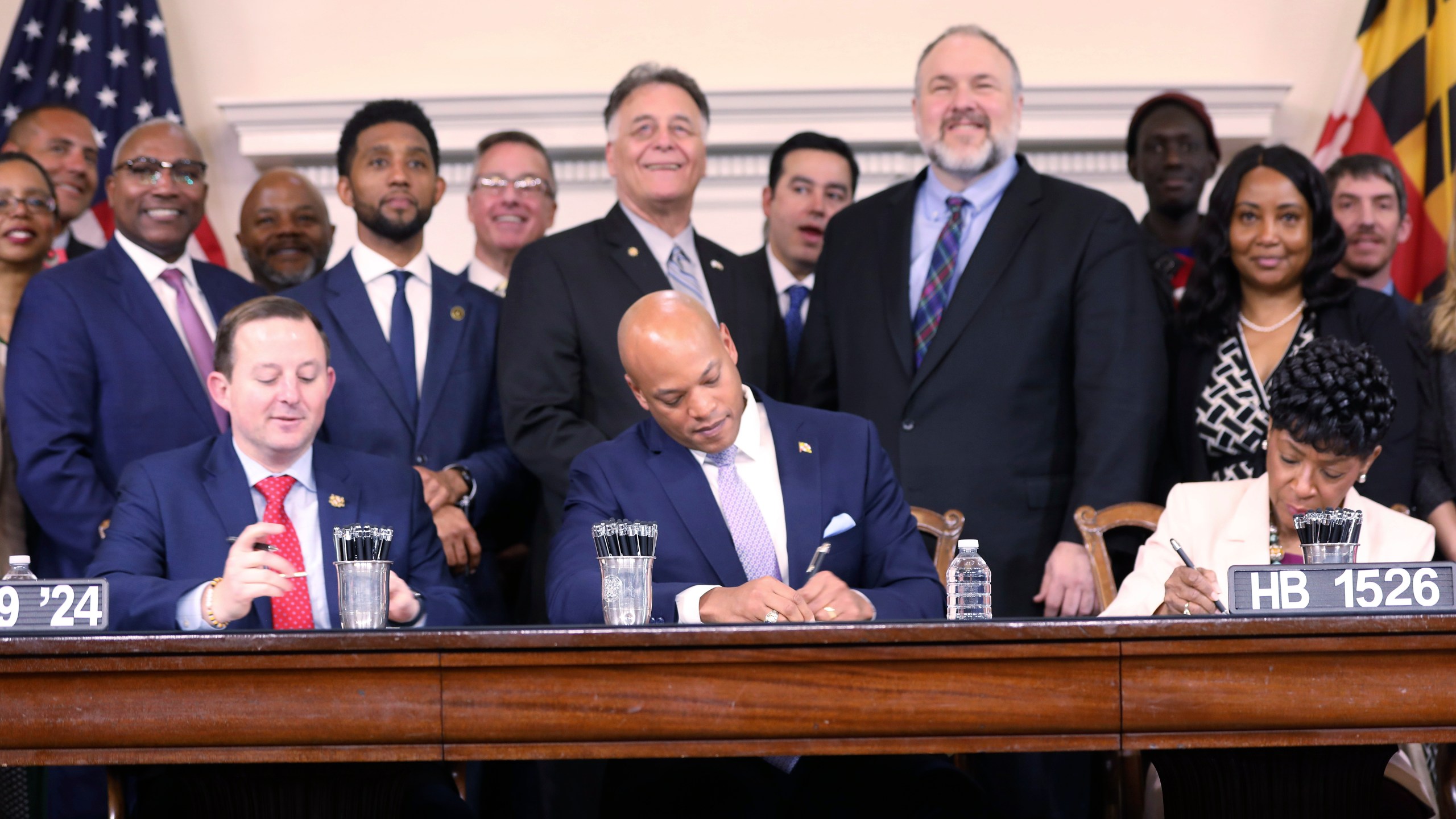 Maryland Gov. Wes Moore signs legislation on Tuesday, April 9, 2024 in Annapolis, Md., to help employees of the Port of Baltimore affected by the Francis Scott Key Bridge collapse. It authorizes use of the state's rainy day fund to provide financial help. (AP Photo/Brian Witte)