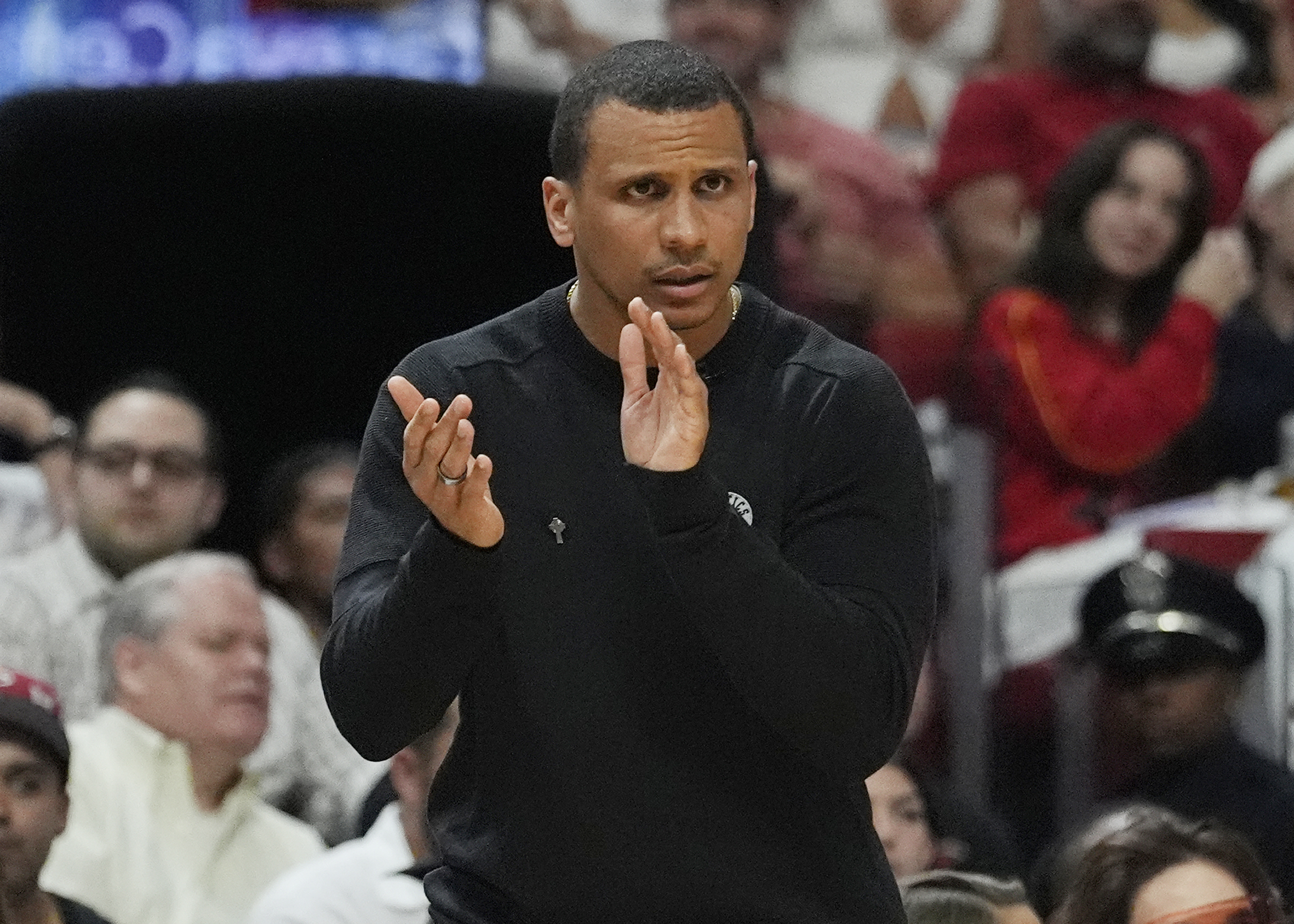 Boston Celtics head coach Joe Mazzulla claps during the second half of Game 4 of an NBA basketball first-round playoff series against the Miami Heat, Monday, April 29, 2024, in Miami. (AP Photo/Marta Lavandier)