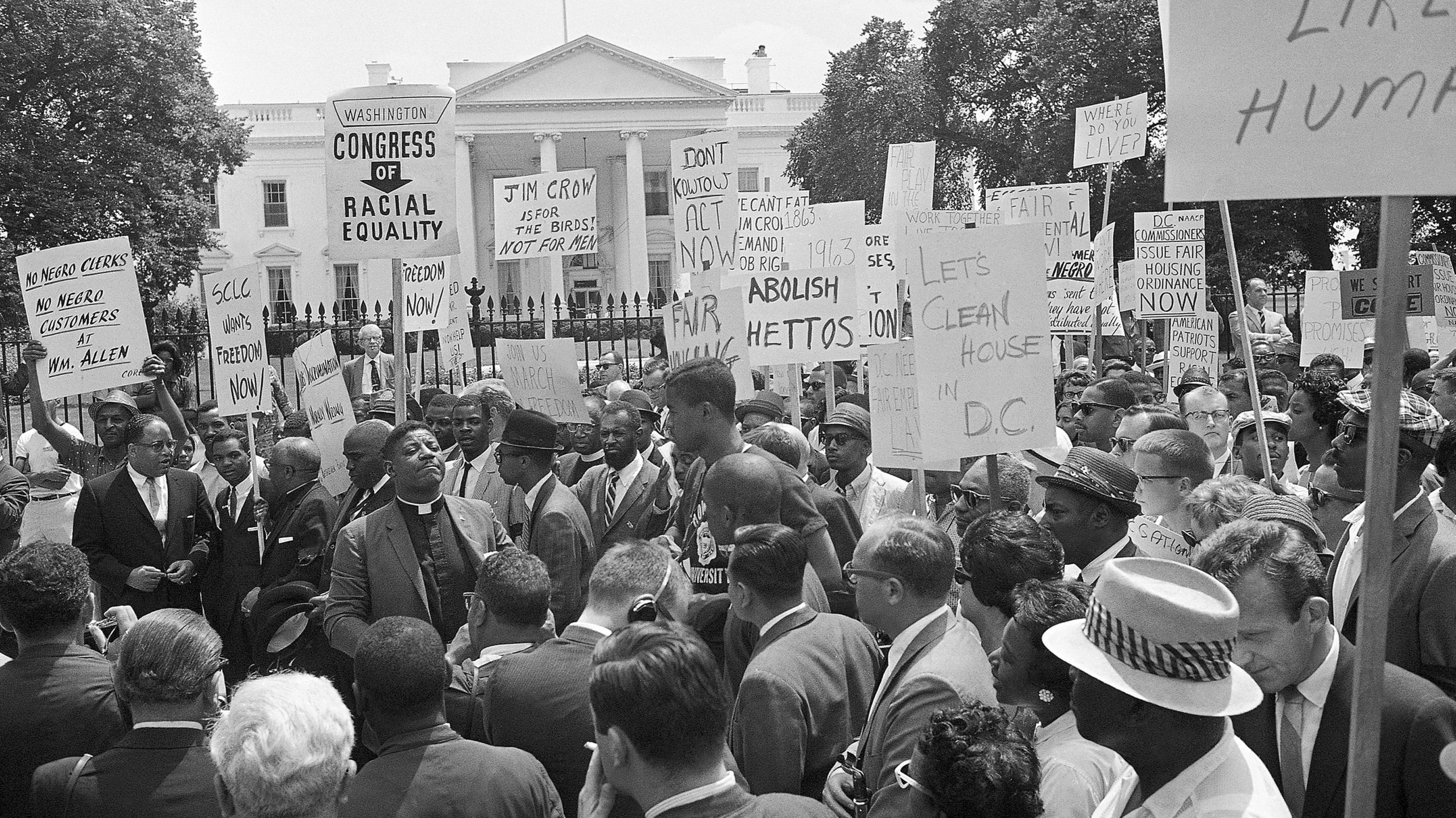 FILE - A group of demonstrators pause in front of the White House for a prayer, June 14, 1963. Leading the demonstrators is Bishop Smallwood Williams, slightly left of center, of Washington. They’re hallmarks of American history: protests, rallies, sit-ins, marches, disruptions. They date from the early days of what would become the United States to the sights and sounds currently echoing across the landscapes of the nation’s colleges and universities. (AP Photo/Henry Burroughs, File)