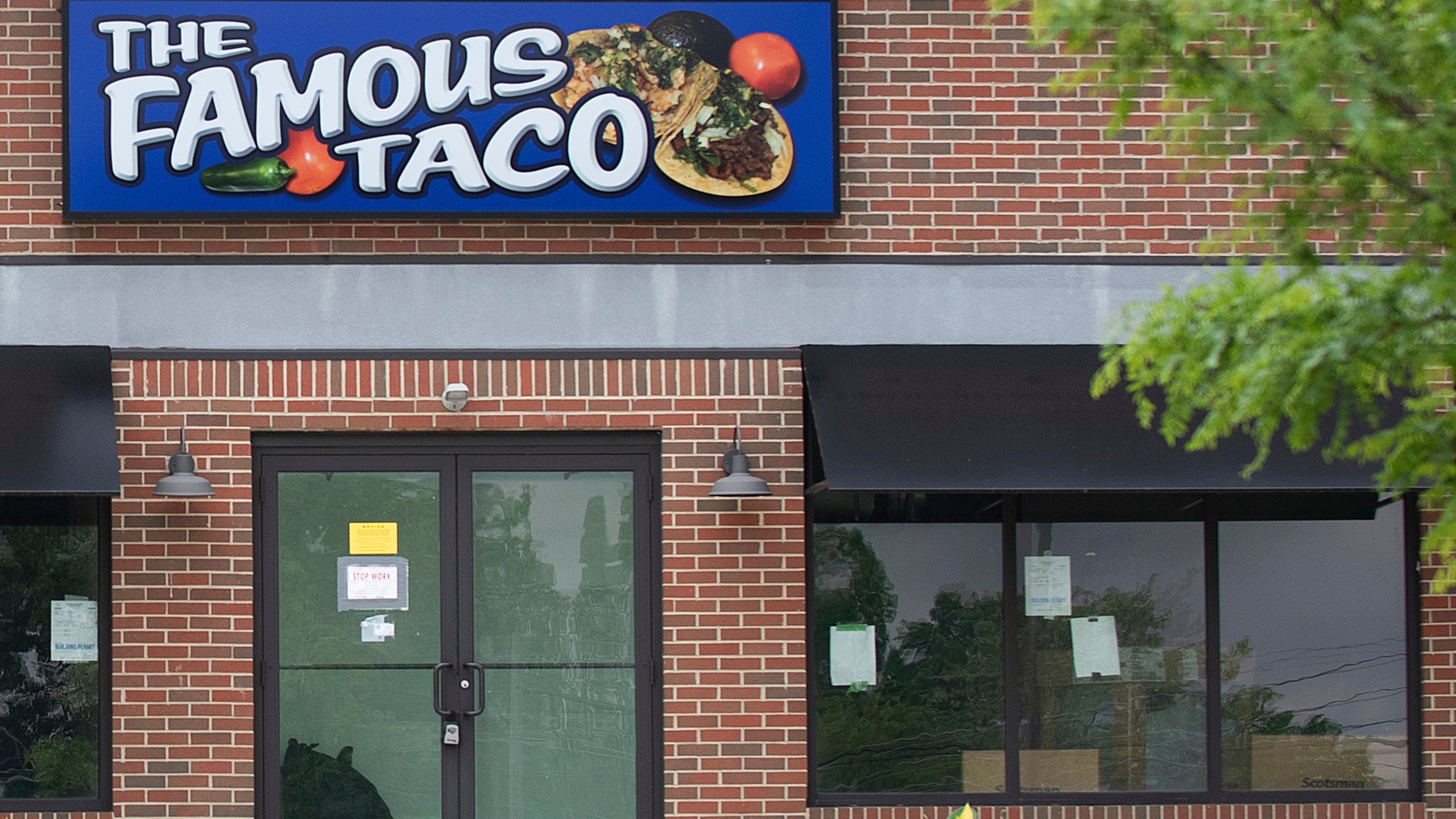 Signage hangs at Famous Taco's new location in Evansville, In., Friday, May 17, 2024. An Indiana judge who declared that “tacos and burritos are Mexican-style sandwiches” has cleared the way for the opening of the restaurant's second location in Fort Wayne, delighting a restauranteur following a legal battle. (Stan Sussina/The Journal-Gazette via AP)