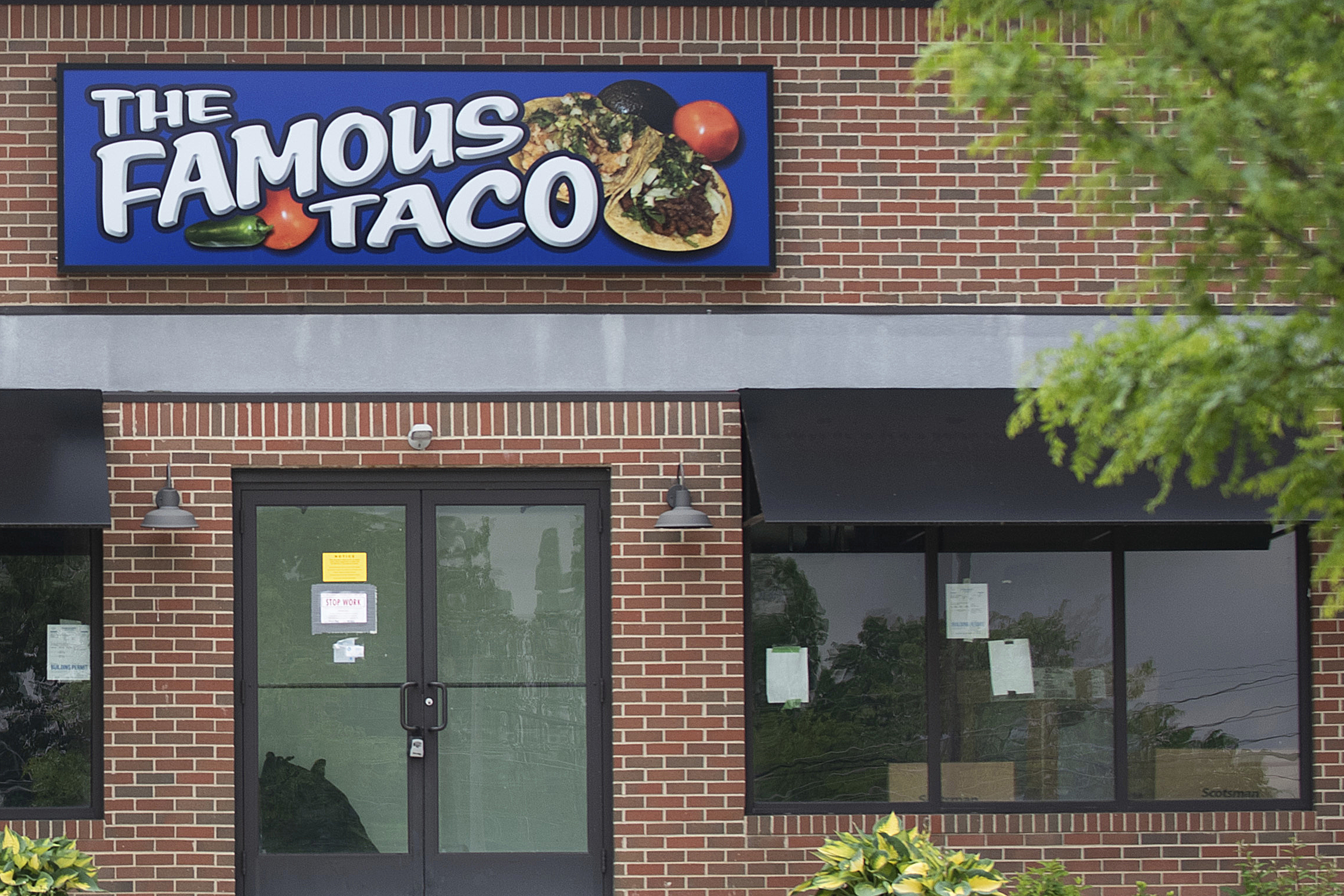 Signage hangs at Famous Taco's new location in Evansville, In., Friday, May 17, 2024. An Indiana judge who declared that “tacos and burritos are Mexican-style sandwiches” has cleared the way for the opening of the restaurant's second location in Fort Wayne, delighting a restauranteur following a legal battle. (Stan Sussina/The Journal-Gazette via AP)