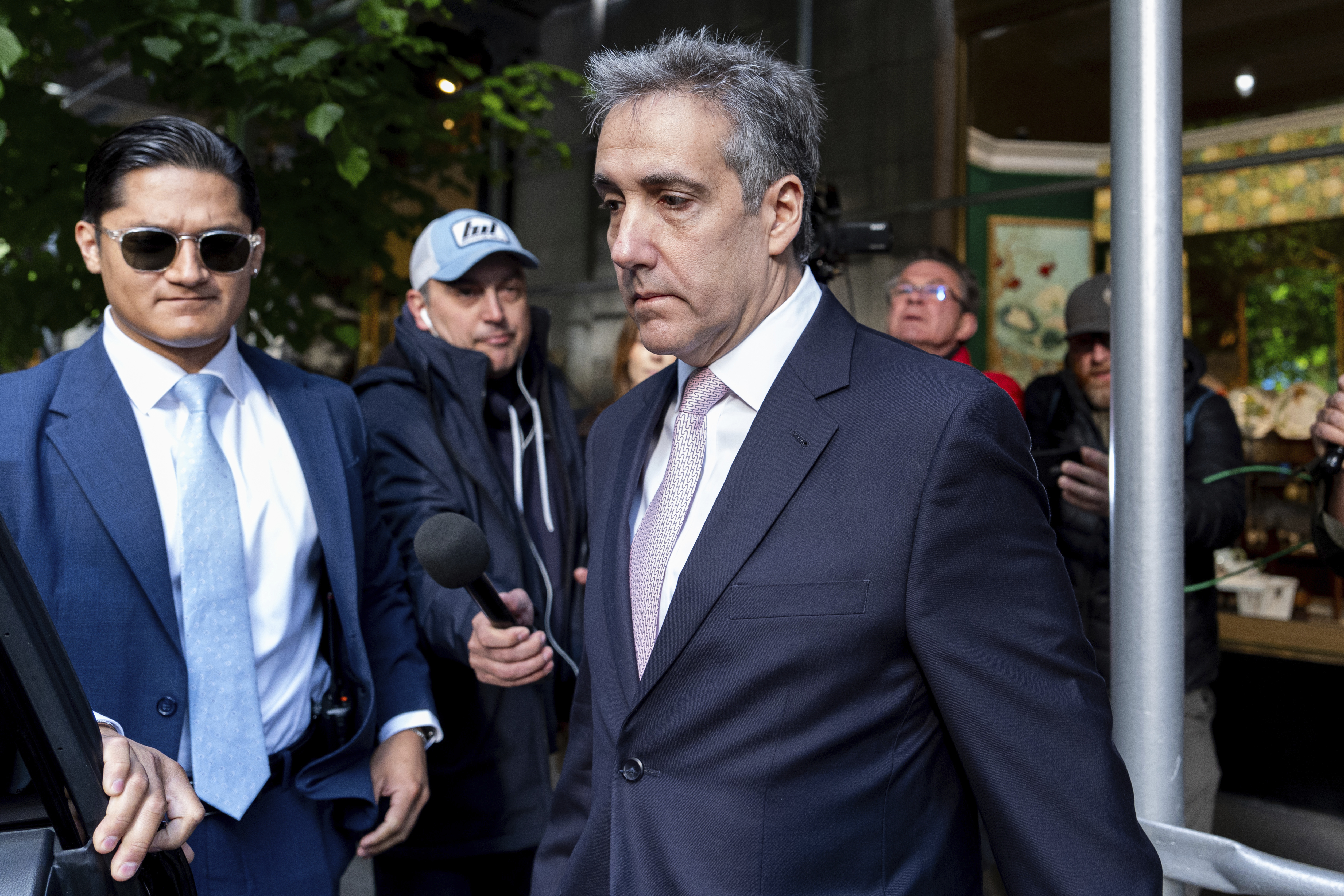 FILE - Michael Cohen leaves his apartment building on his way to Manhattan criminal court, May 13, 2024, in New York. Donald Trump's hush money trial is heading into the final stretch. The landmark trial will kick back off Monday, May 20, in Manhattan with more defense cross-examination of former Trump attorney Cohen. Cohen's pivotal testimony directly tied Trump to the alleged hush money scheme. Defense lawyers are trying to paint Cohen as a serial fabulist who is on a revenge campaign against the presumptive Republican presidential nominee. (AP Photo/Julia Nikhinson, File)